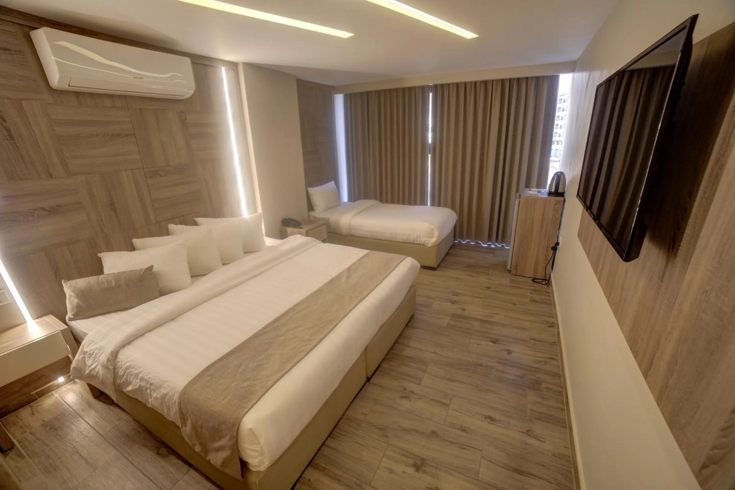 Bed in Alena Boutique Hotel