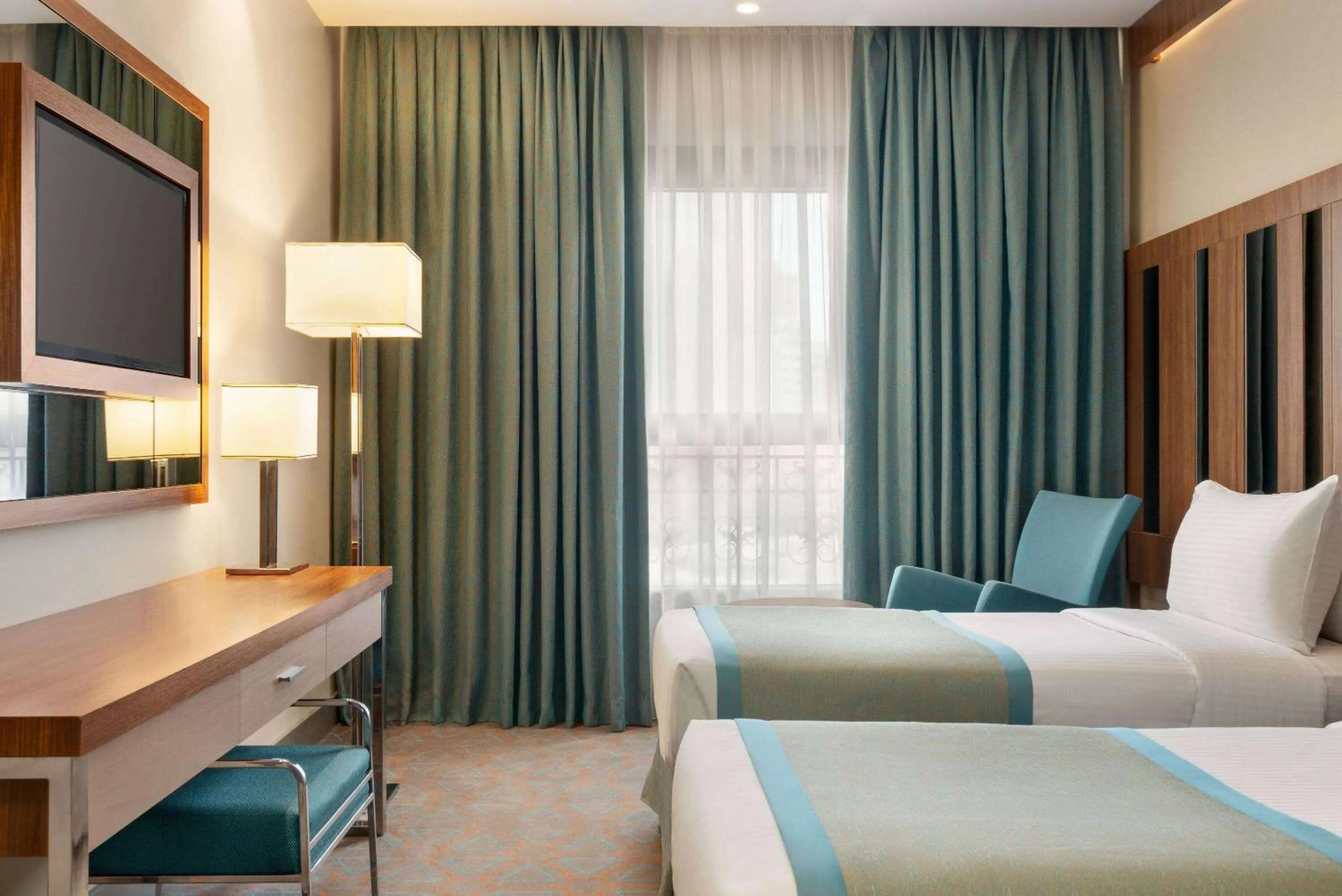 Photo of the whole room, Bed in Ramada by Wyndham Makkah Zad Al Tayseer