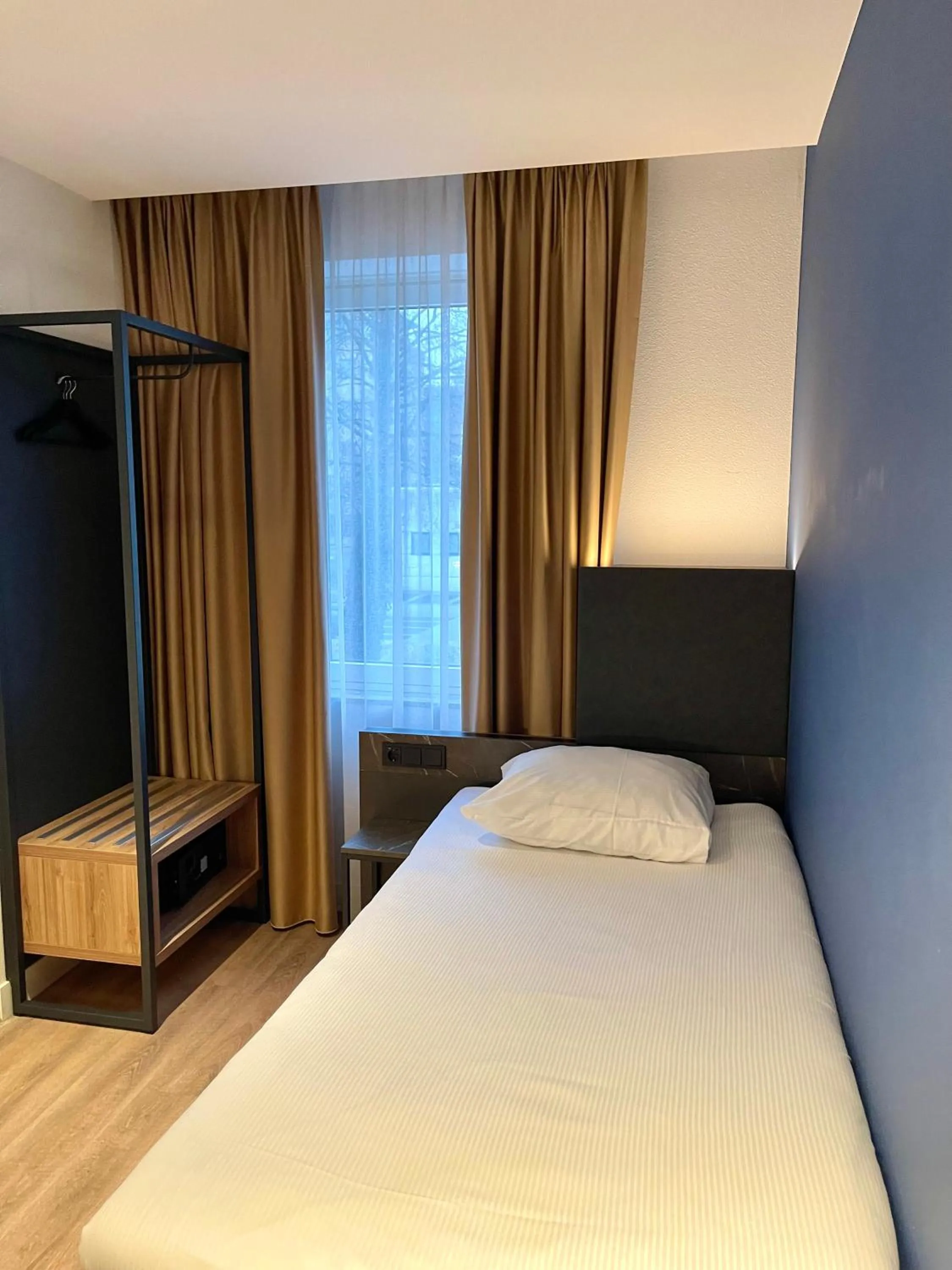 Bed in OZO Hotels Antares Airport