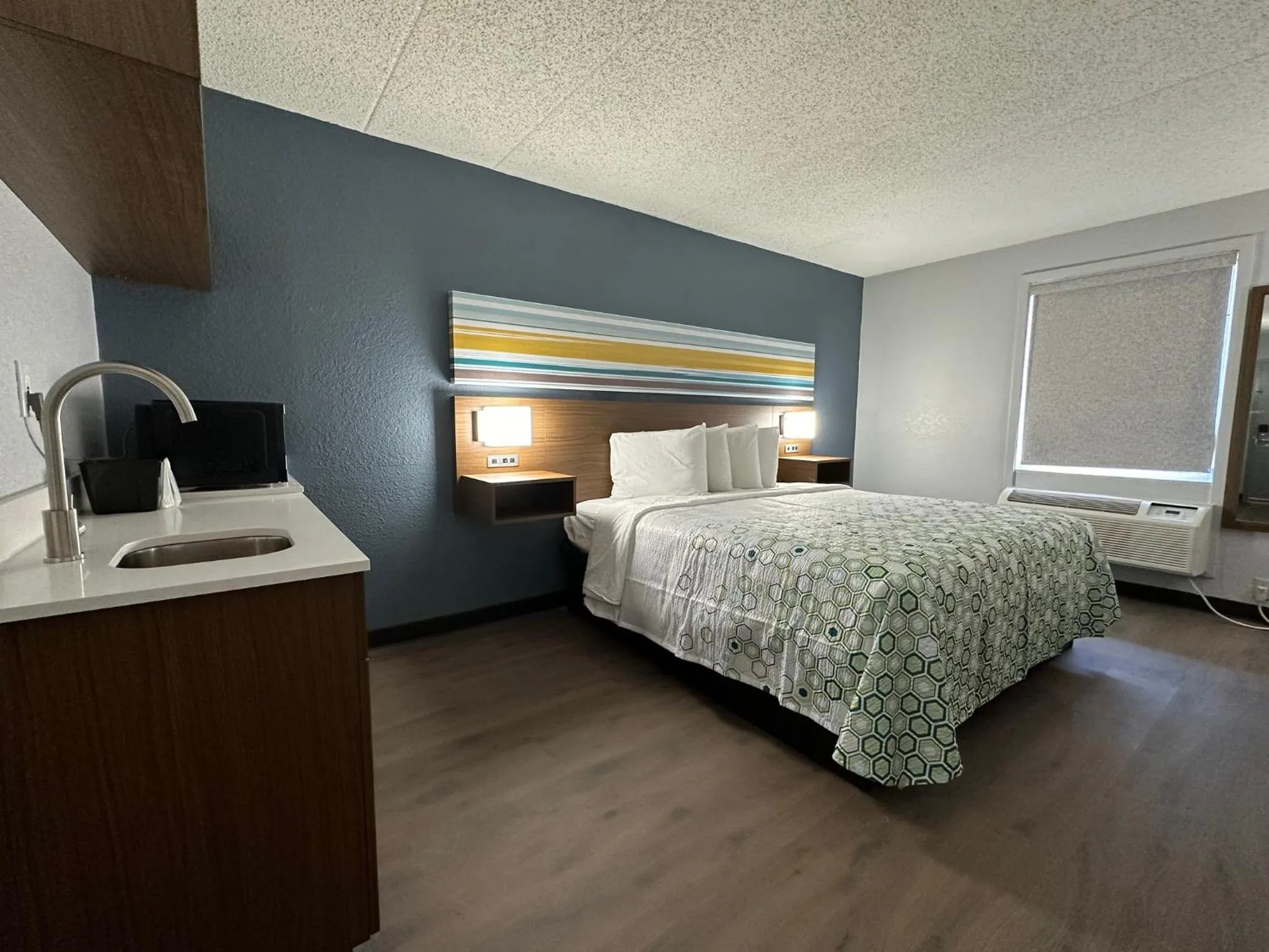 Bedroom, Bed in HomeTowne Studios by Red Roof Richmond, VA - W Broad St