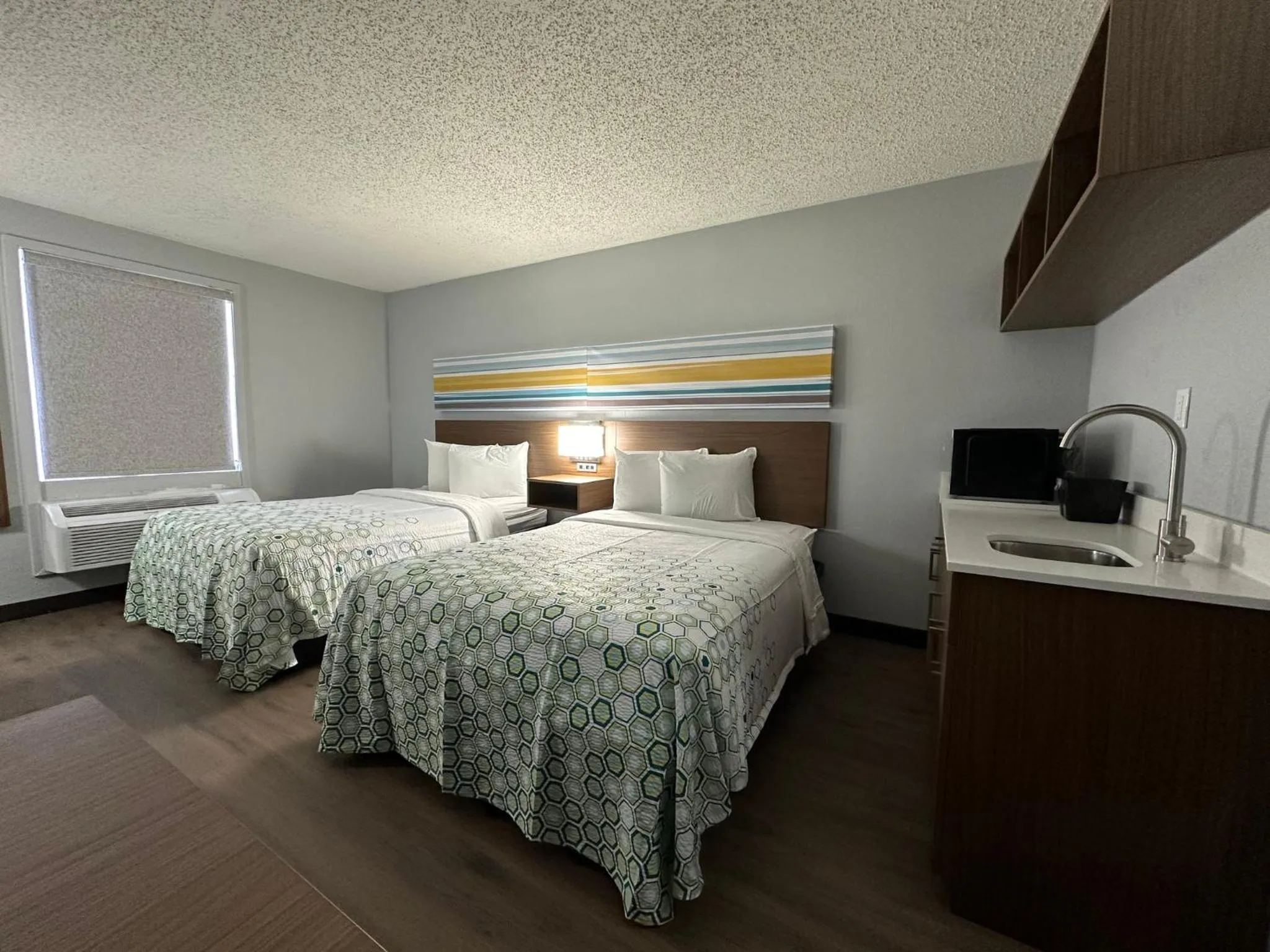 Photo of the whole room, Bed in HomeTowne Studios by Red Roof Richmond, VA - W Broad St