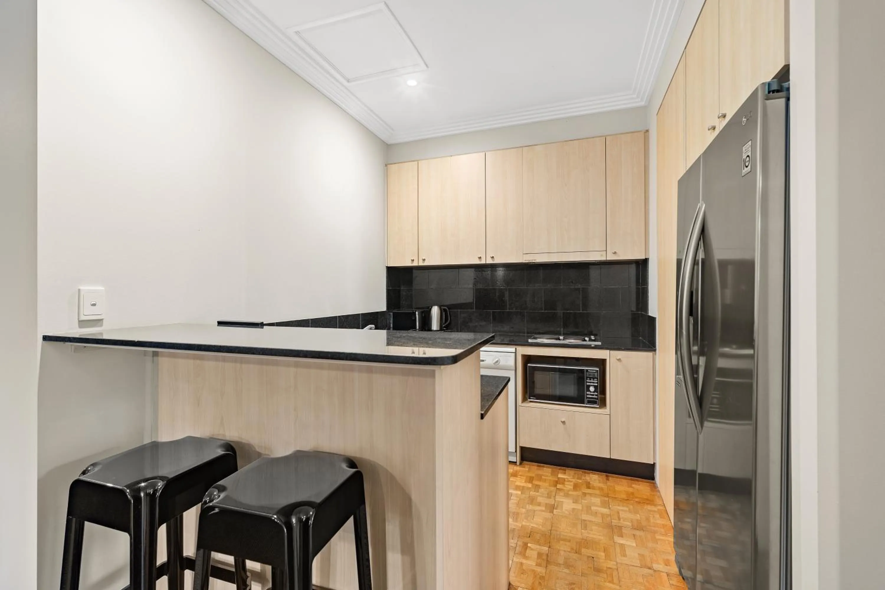 Kitchen or kitchenette in Melbourne City Suites