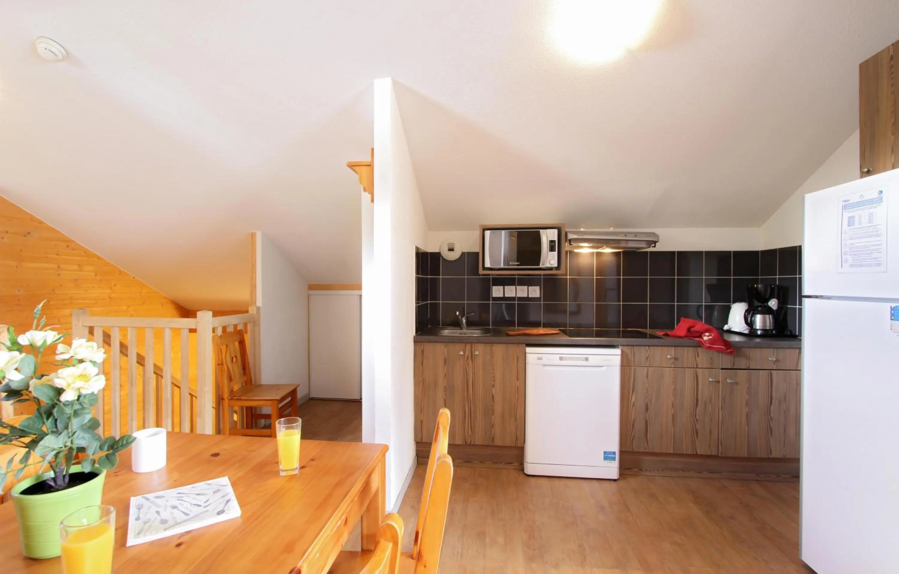 Kitchen or kitchenette in Résidence Odalys L'Ours Blanc