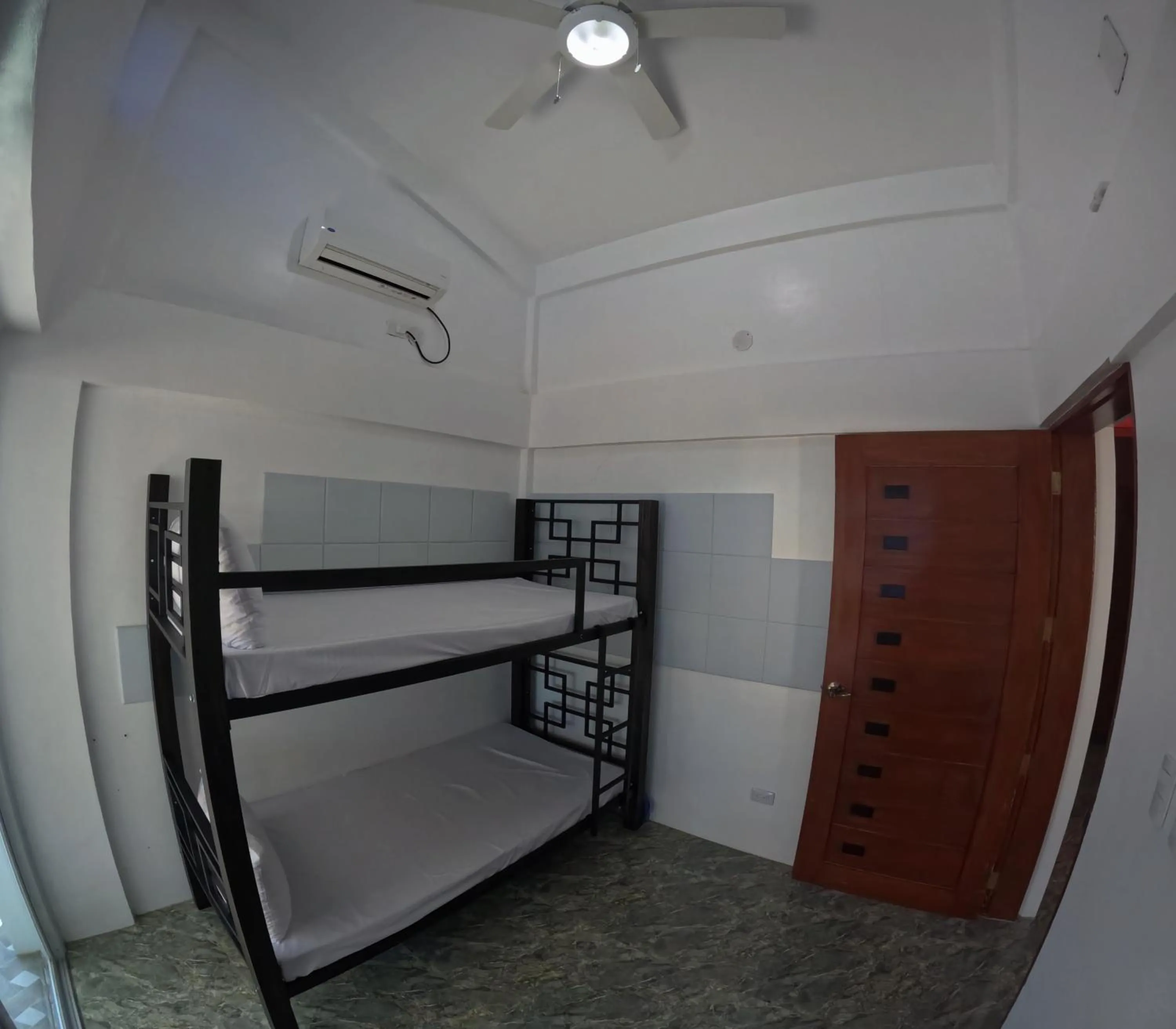 Bed in The Blessed Purple Bamboo Beach Resort