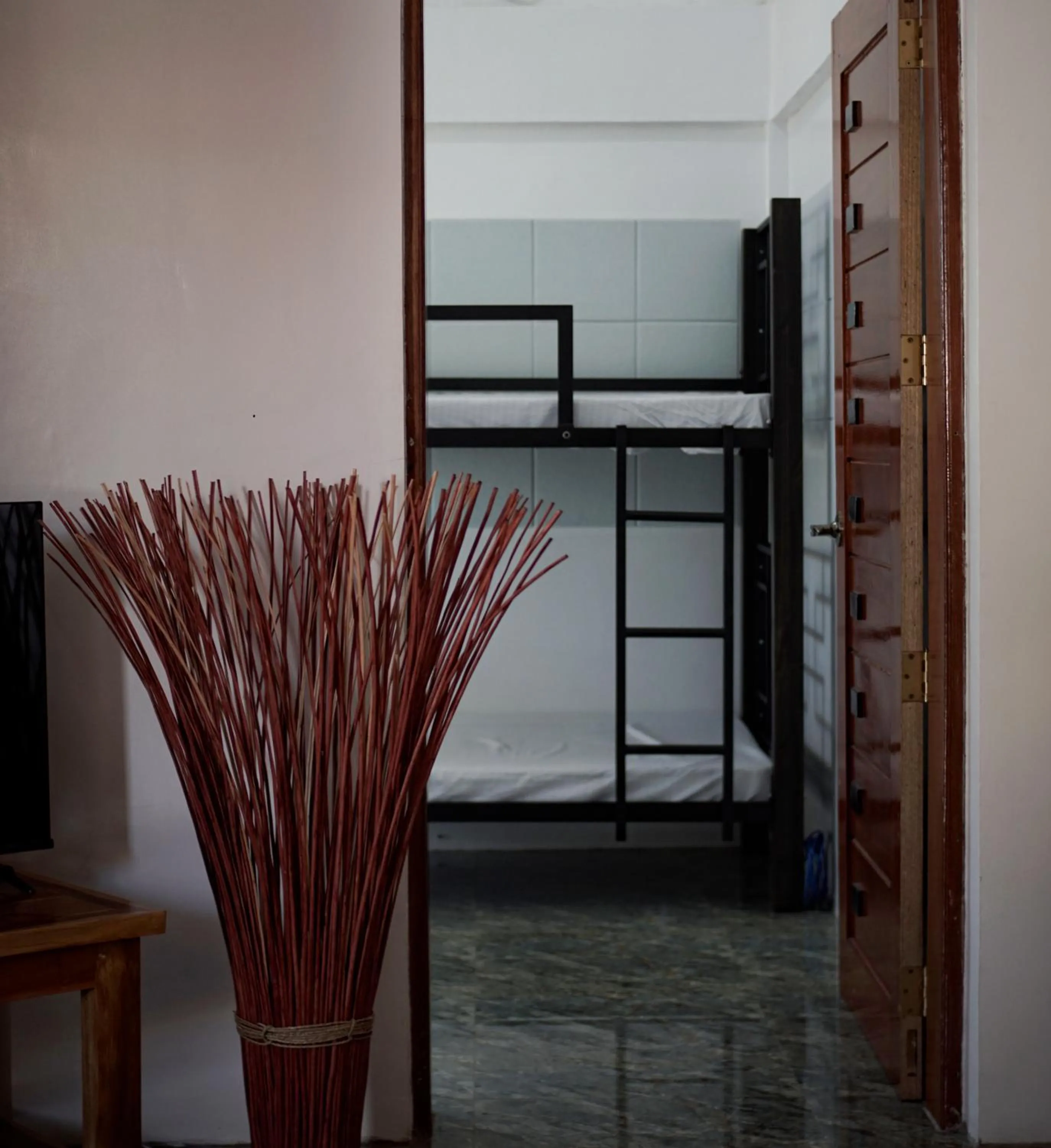 Bed in The Blessed Purple Bamboo Beach Resort