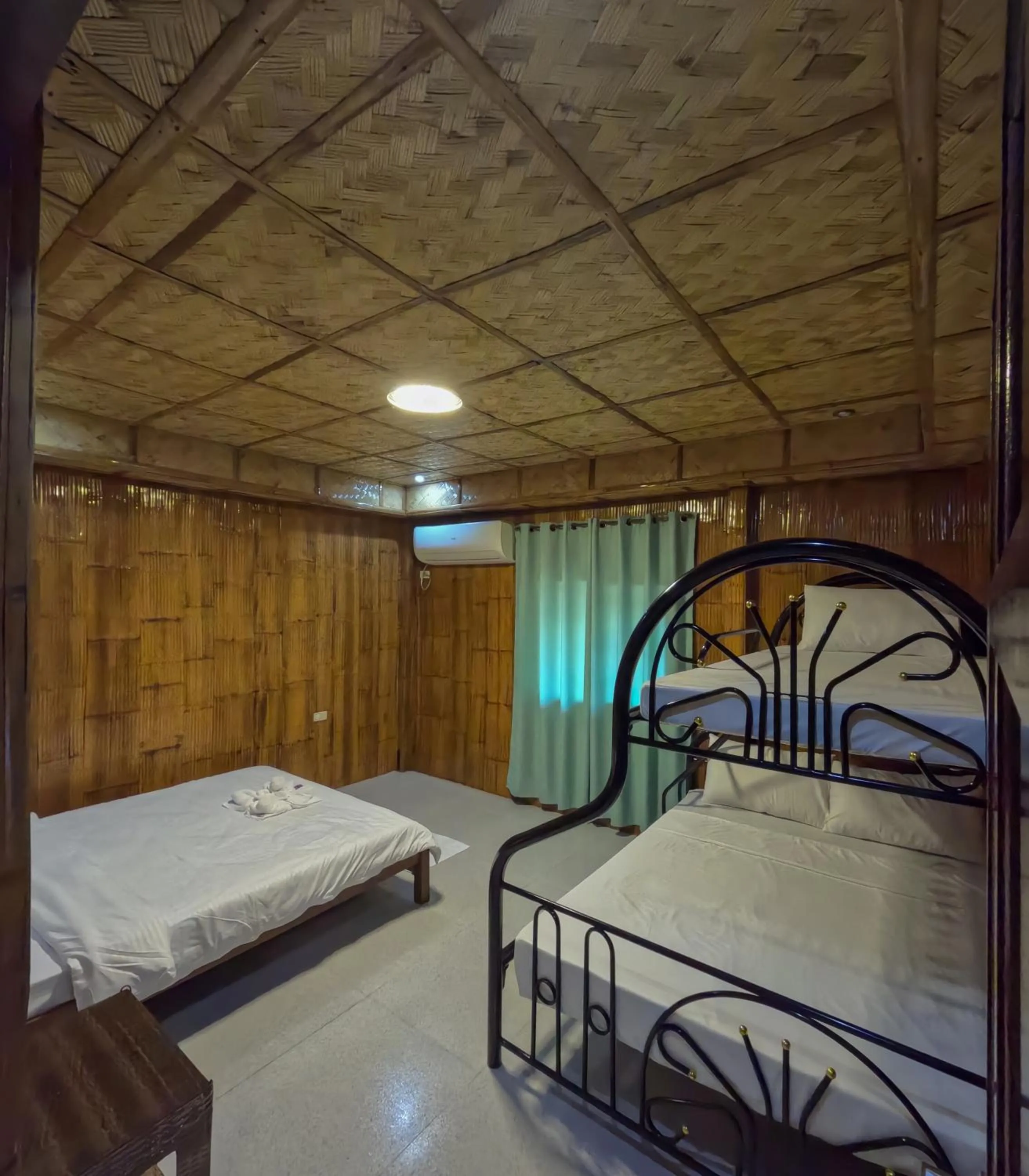 Bed in The Blessed Purple Bamboo Beach Resort