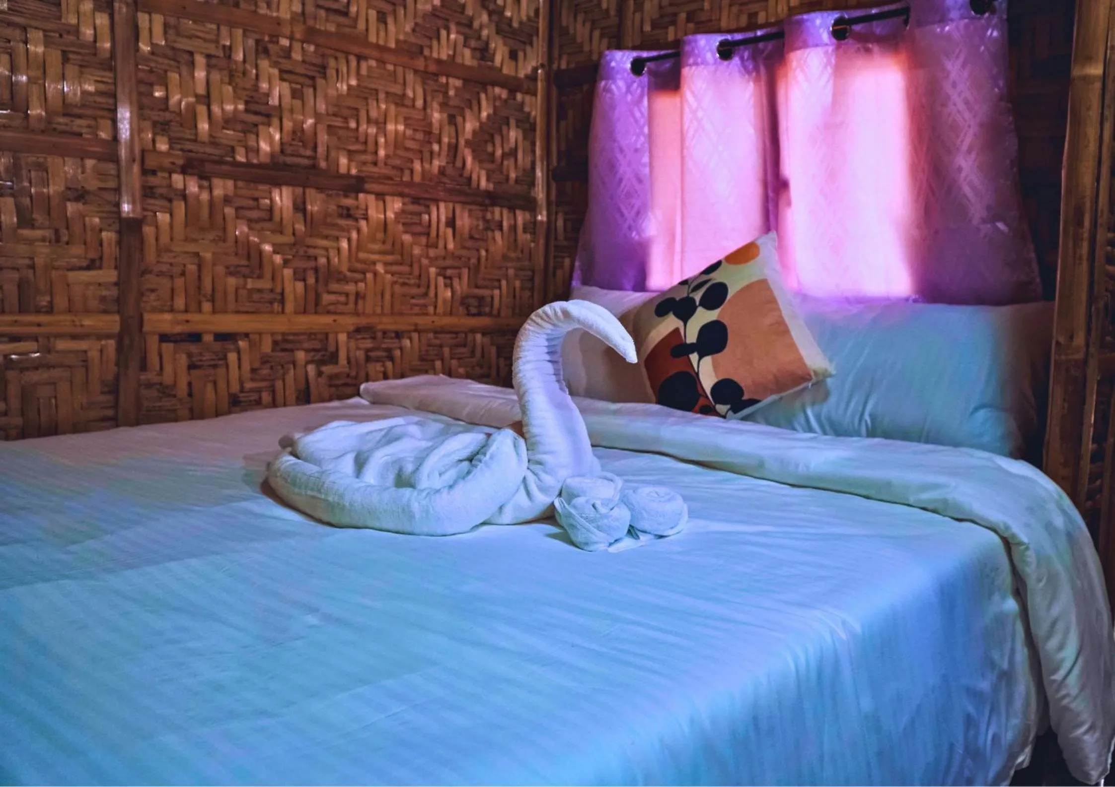 Bed in The Blessed Purple Bamboo Beach Resort