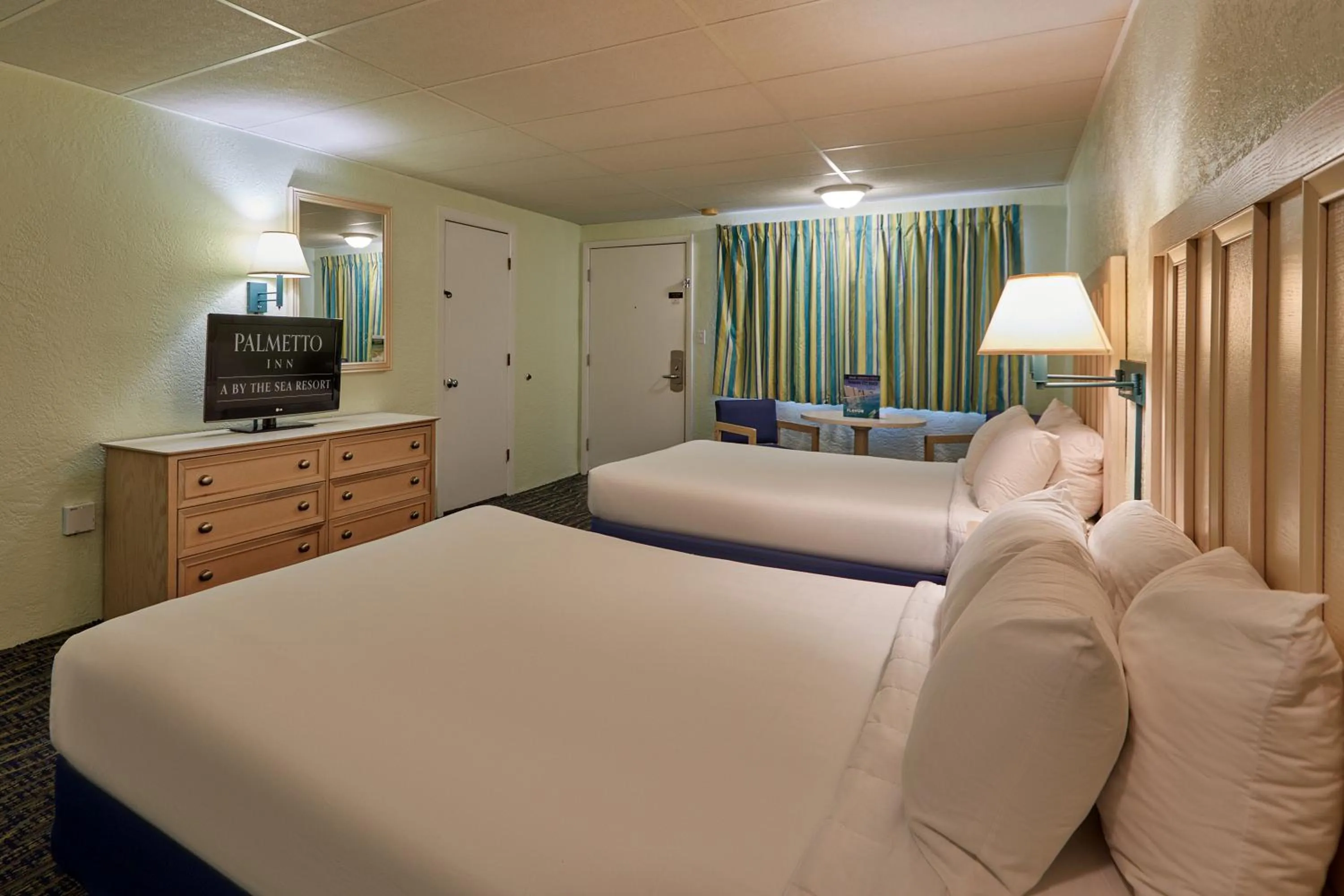 Bed in Palmetto Beachfront Hotel, a By The Sea Resort