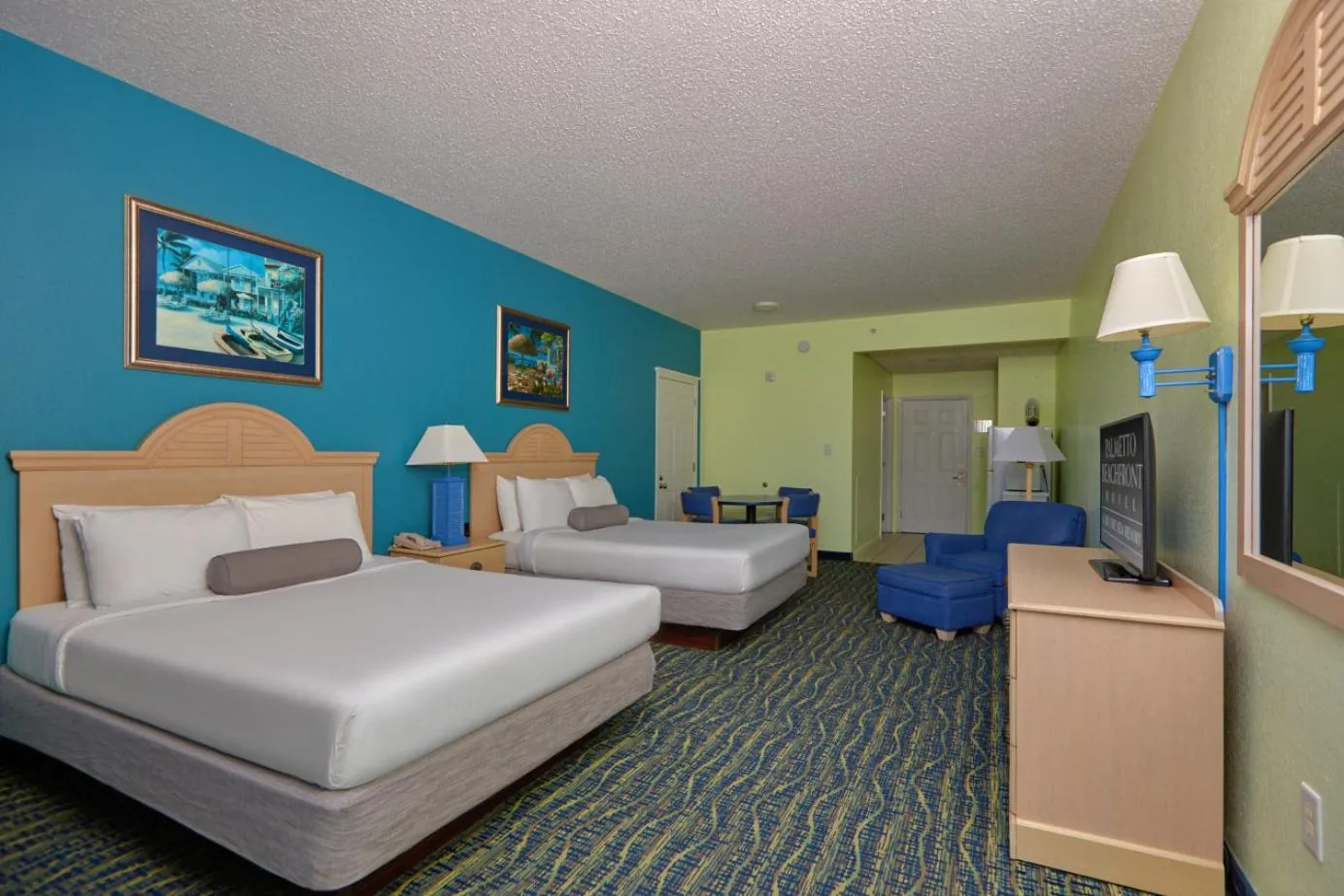 Bed in Palmetto Beachfront Hotel, a By The Sea Resort