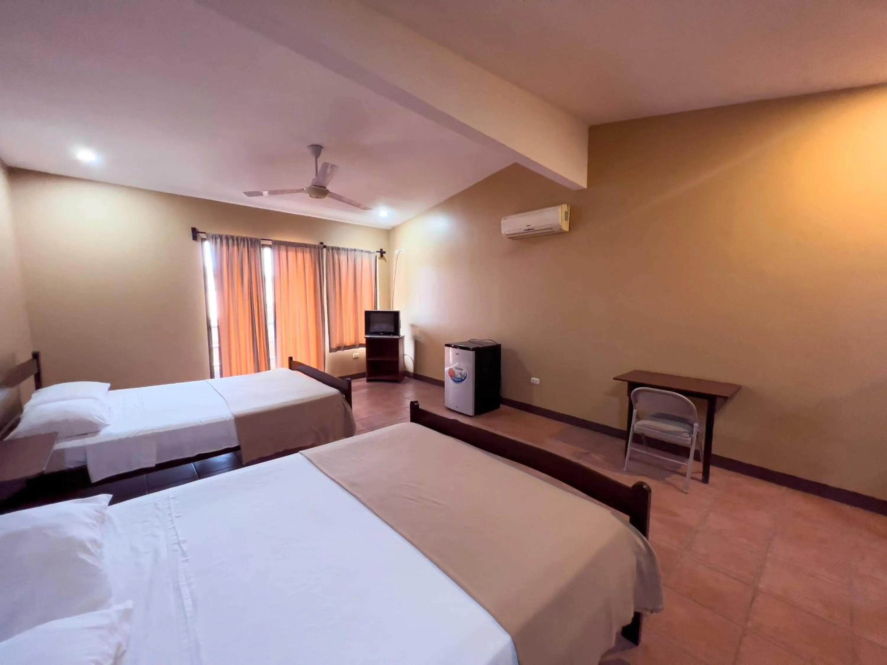 Photo of the whole room, Bed in Belen Suites