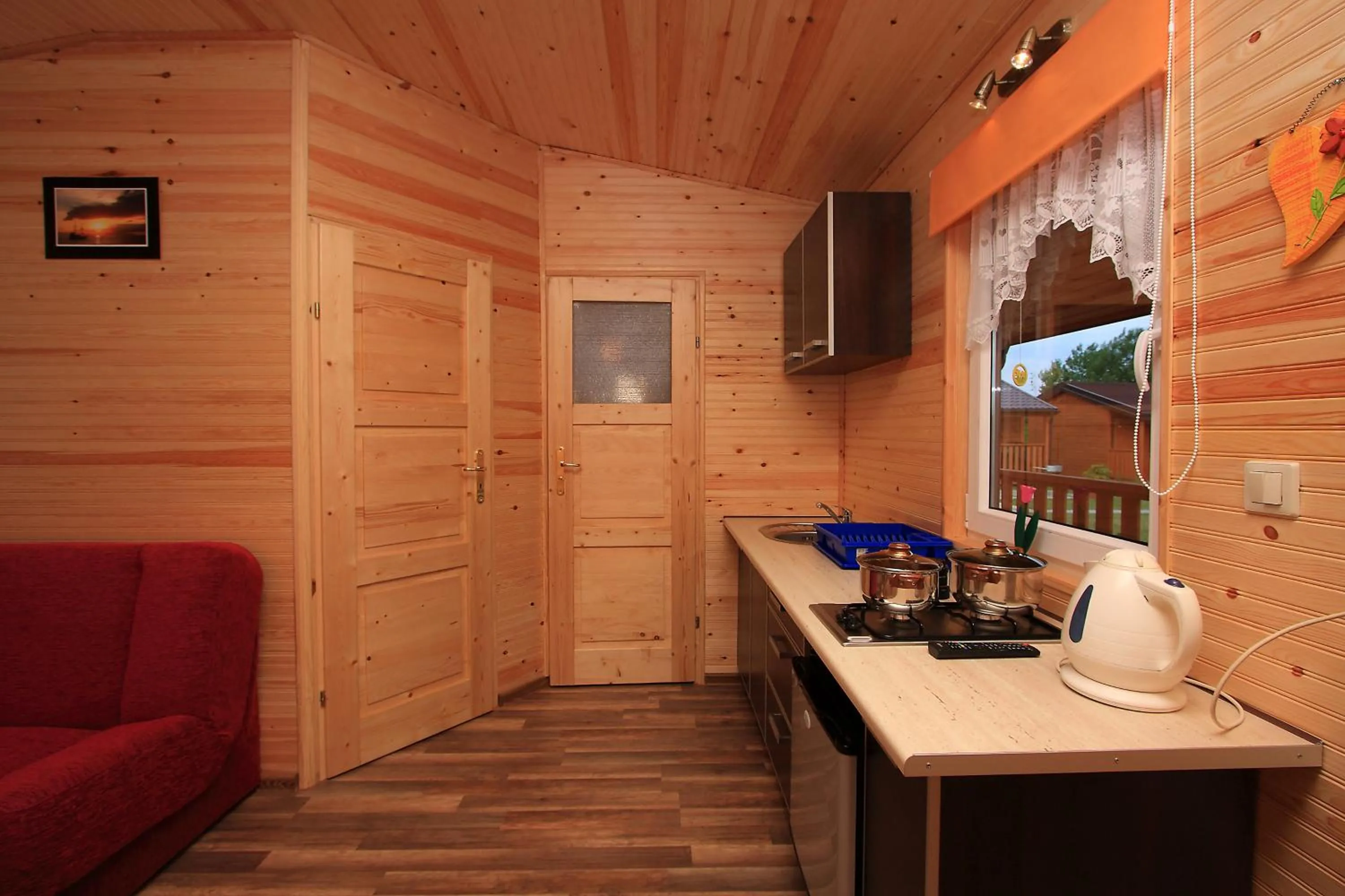 Kitchen or kitchenette in Domki Letniskowe Amelia