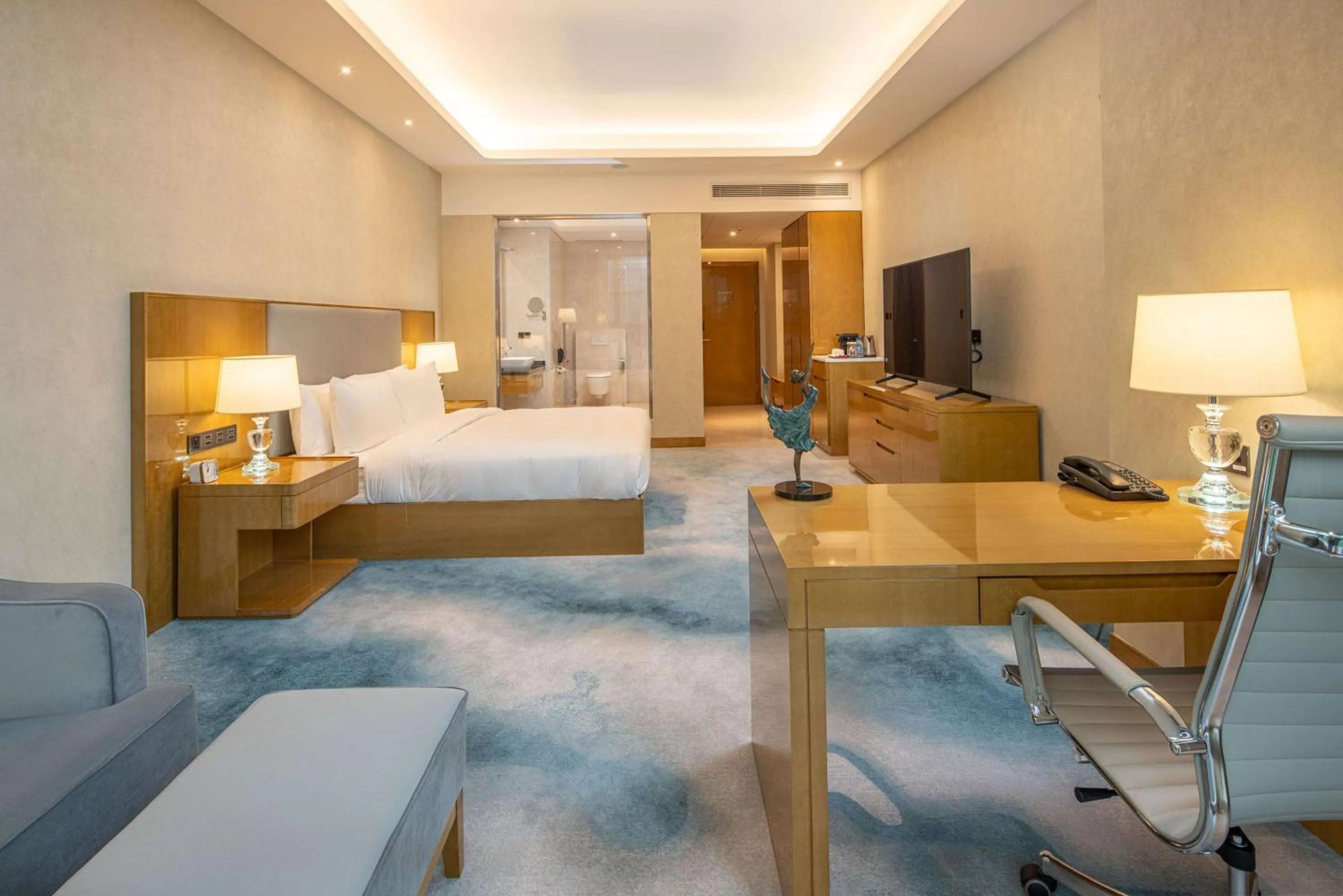 Living room, Bed in Hilton Brazzaville Les Tours Jumelles Hotel & Residences