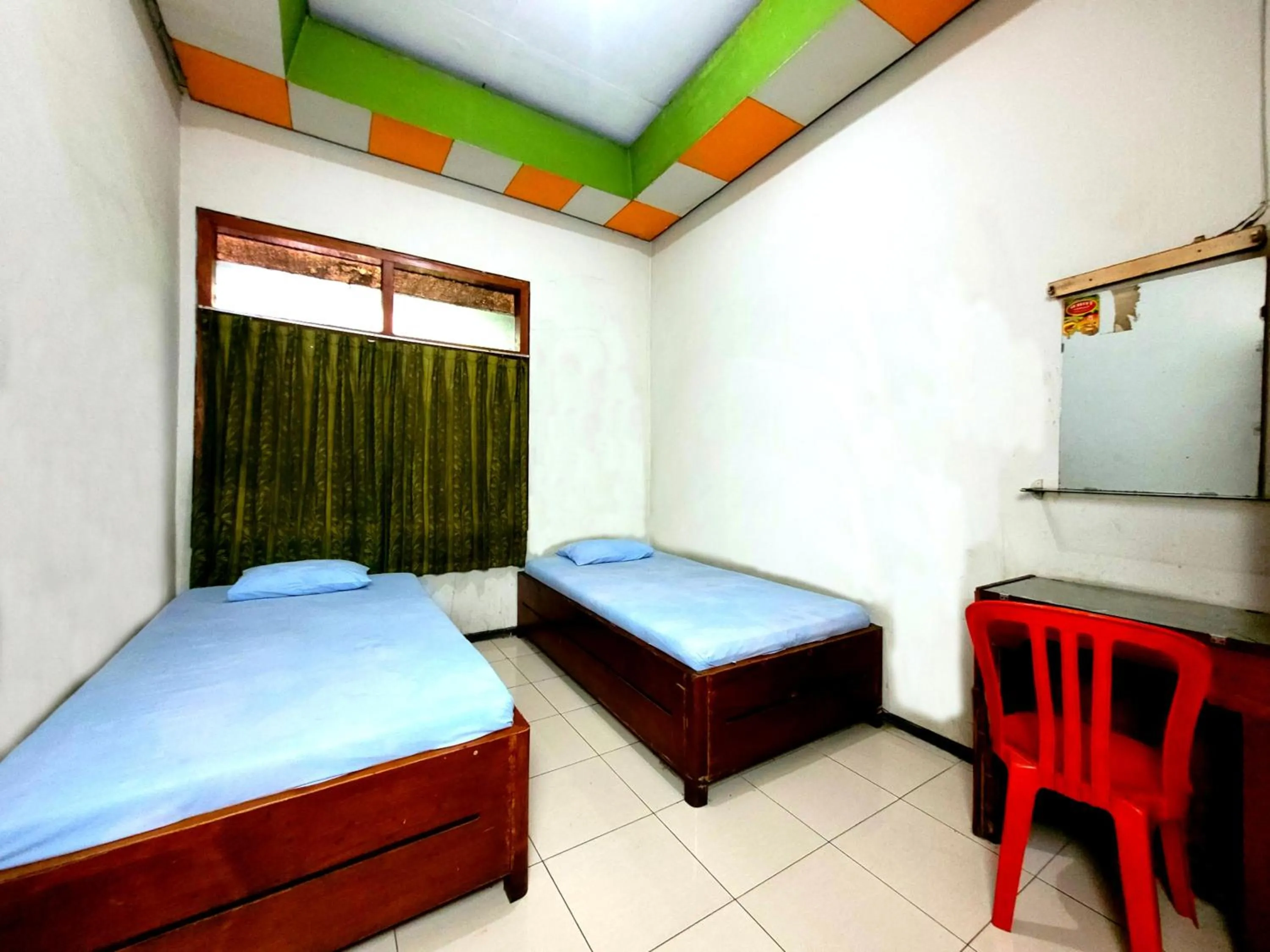 Photo of the whole room, Bed in Hotel Dirgahayu Ponorogo