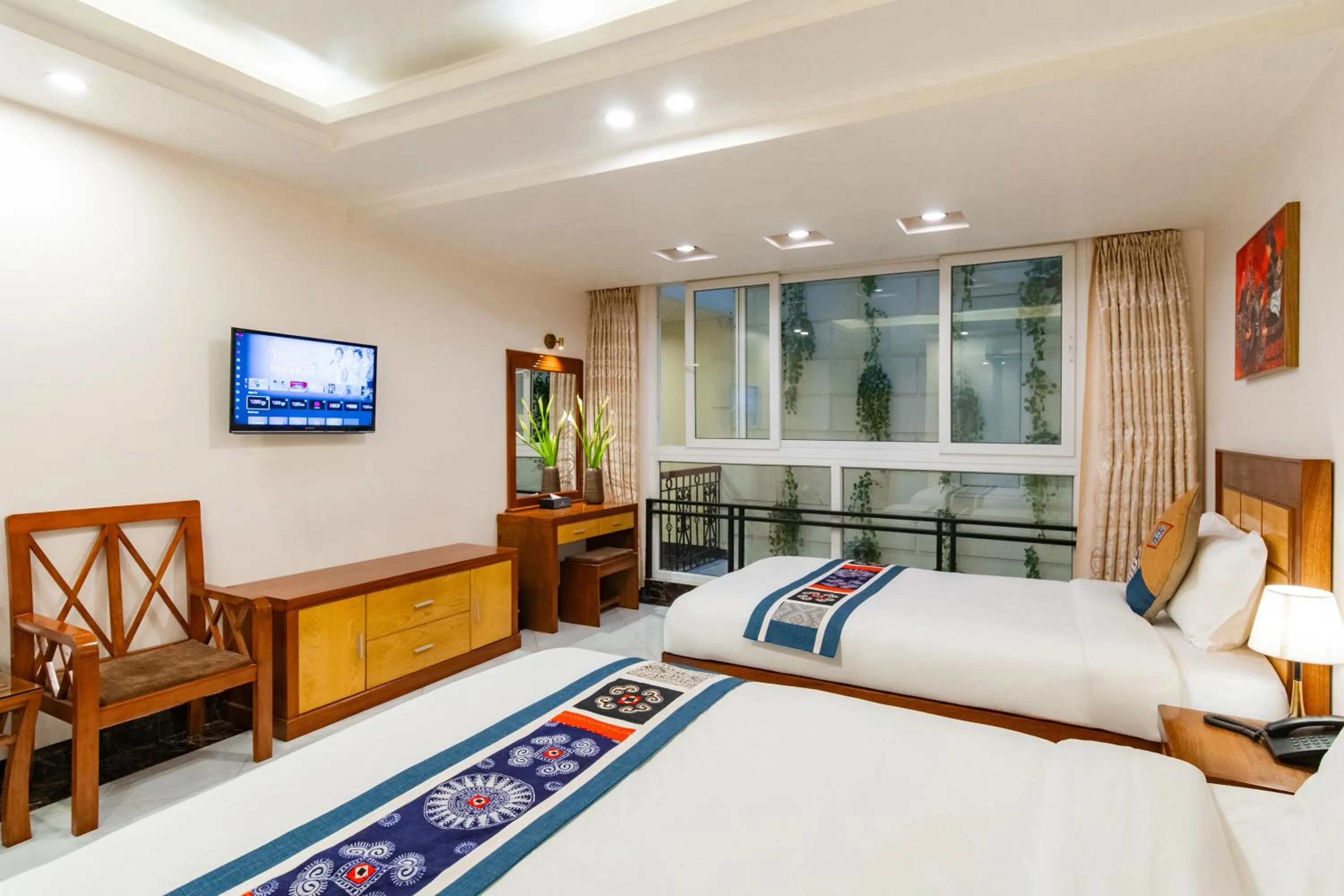 Communal lounge/ TV room, Bed in Sapa Paradise Hotel