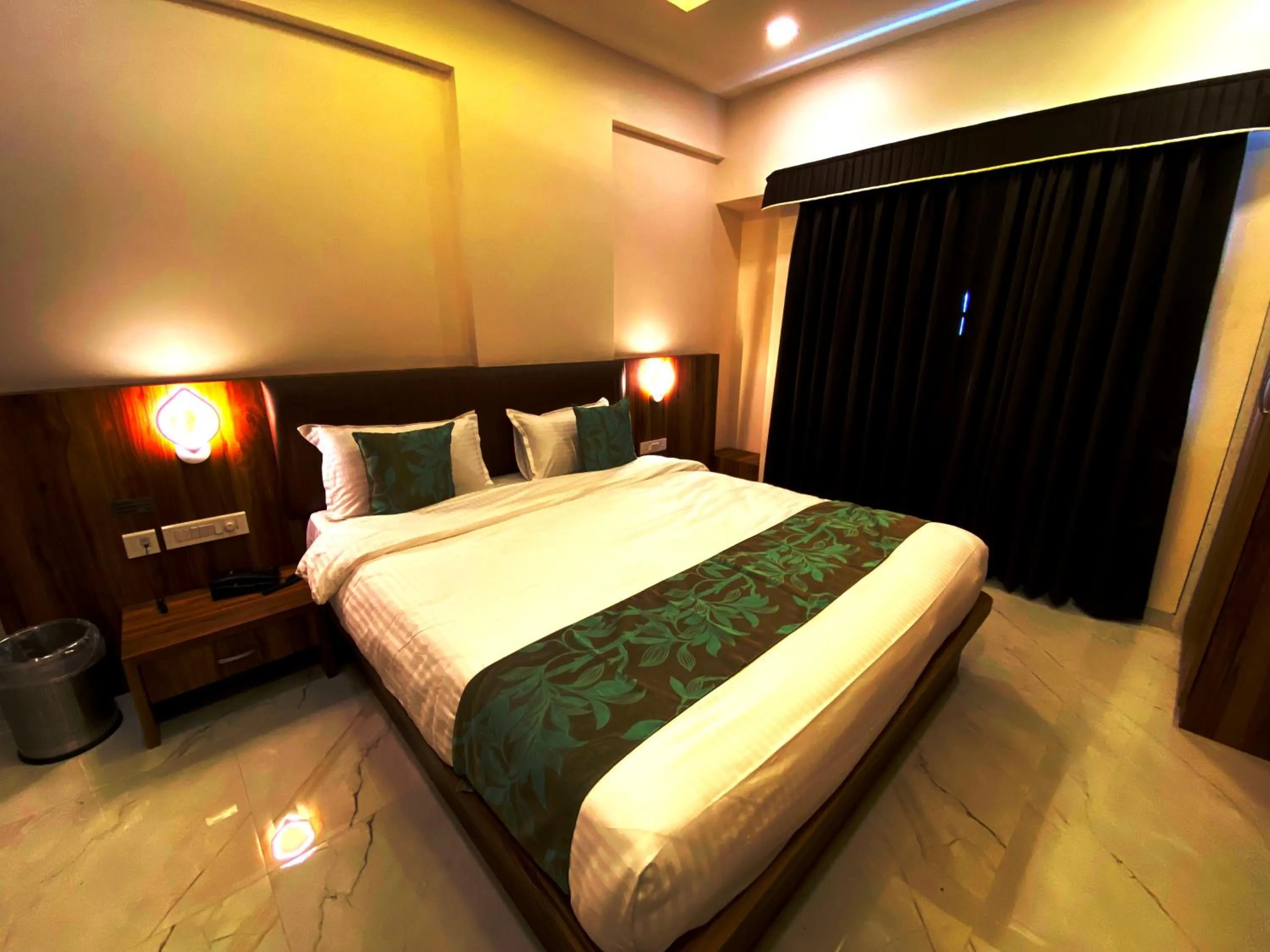 Bedroom in The Grand Sarovar Inn And Suites