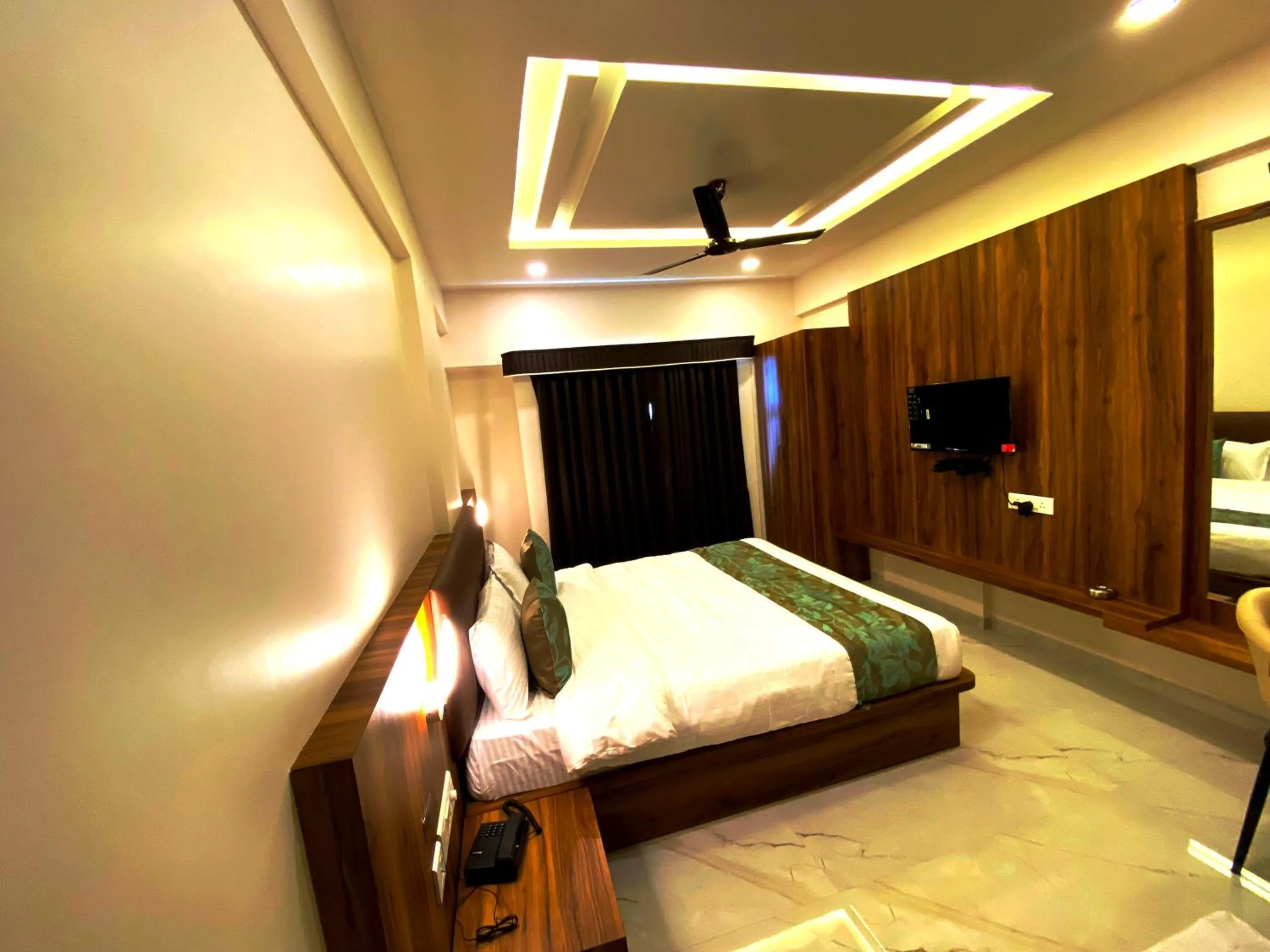 Bedroom in The Grand Sarovar Inn And Suites