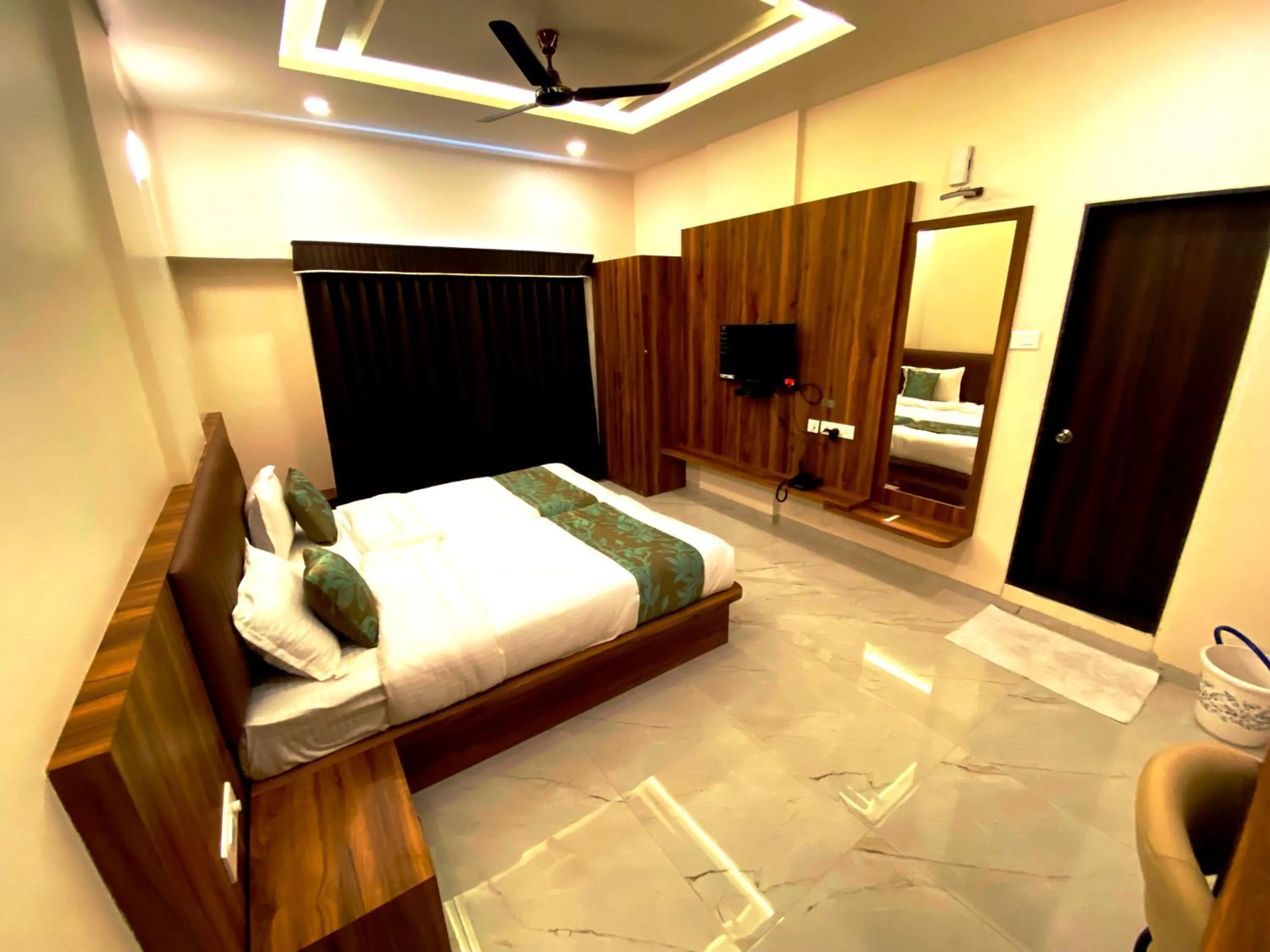 Bedroom in The Grand Sarovar Inn And Suites
