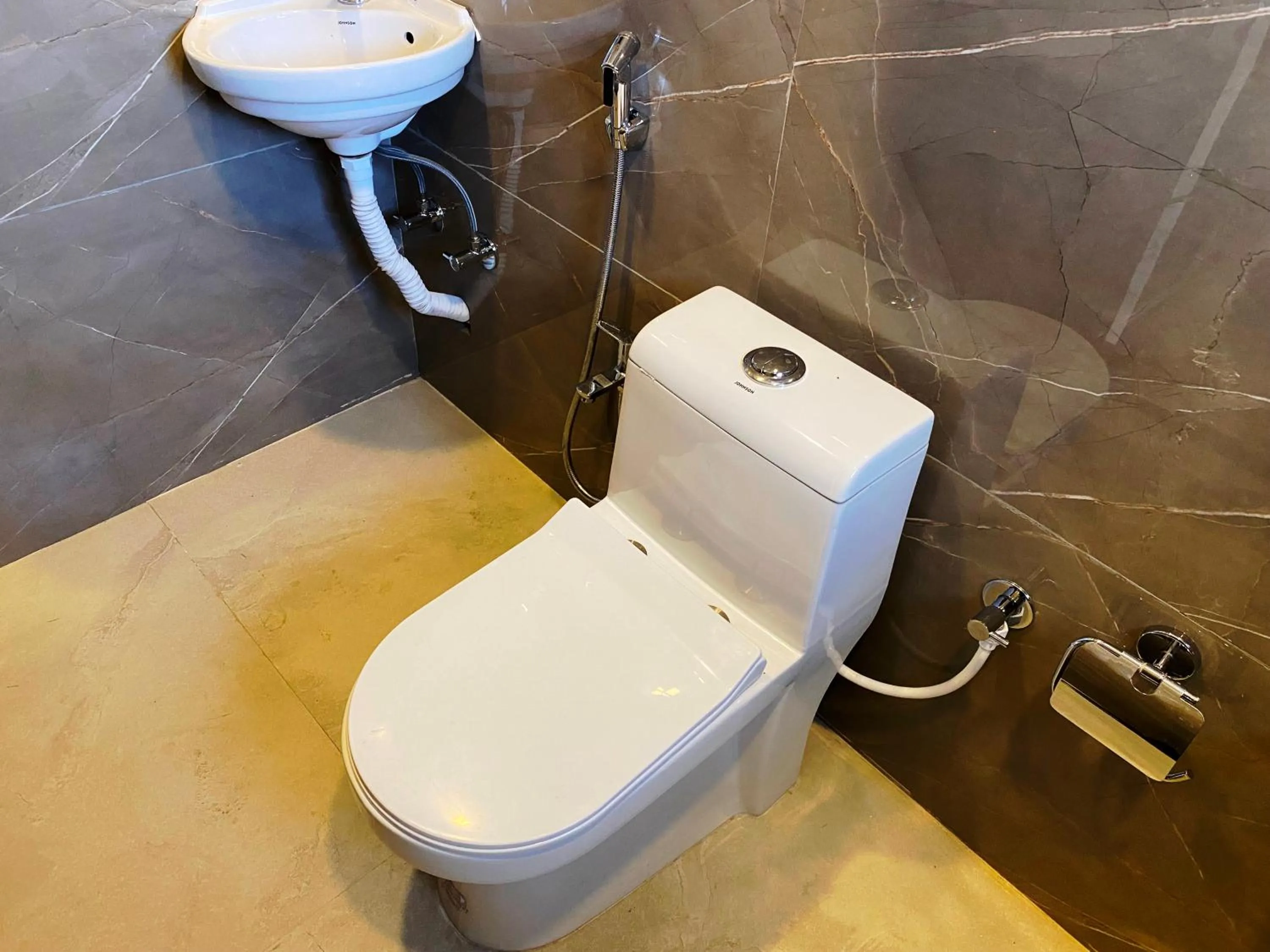 Toilet in The Grand Sarovar Inn And Suites