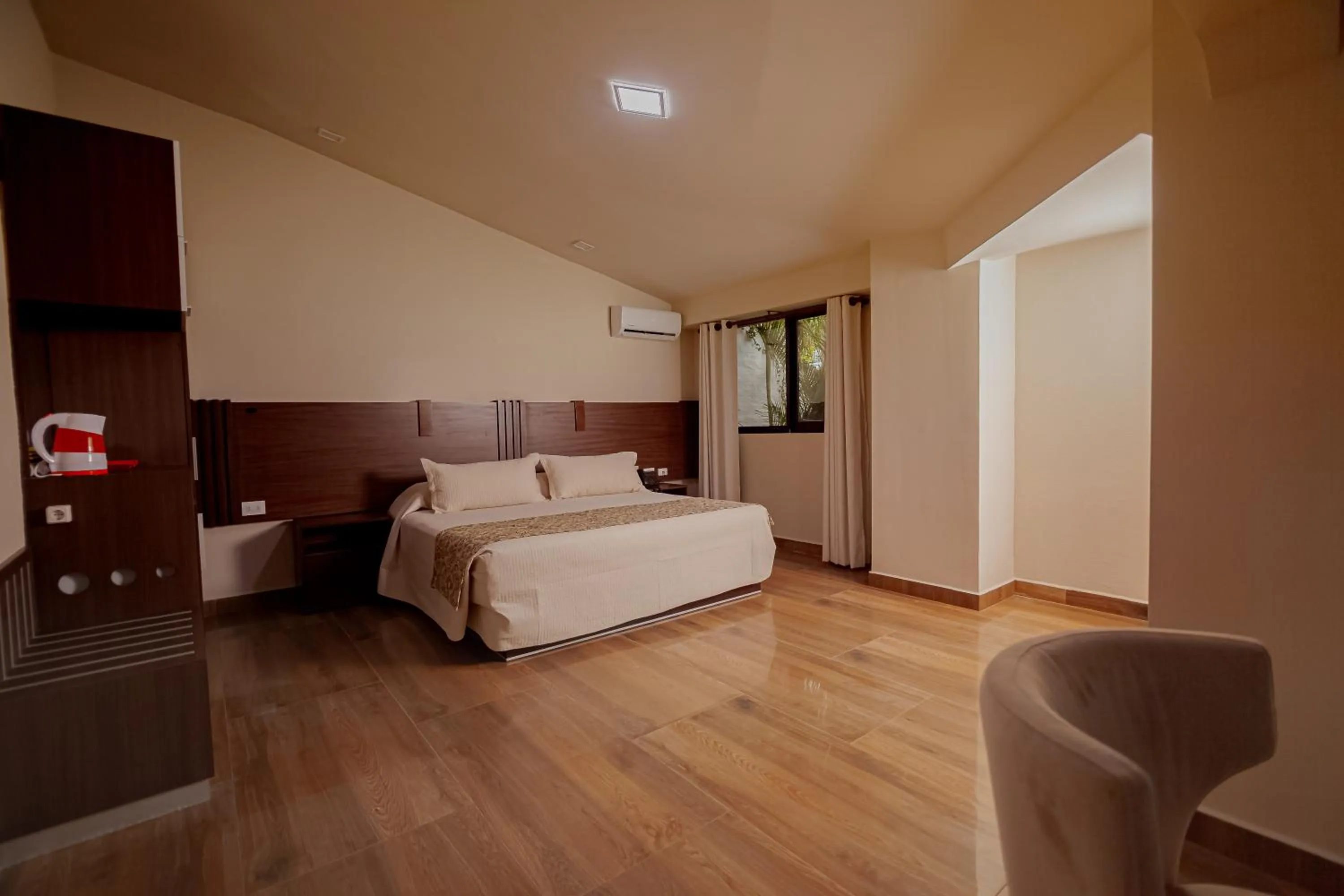 Photo of the whole room, Bed in Hotel Sirari By Regina