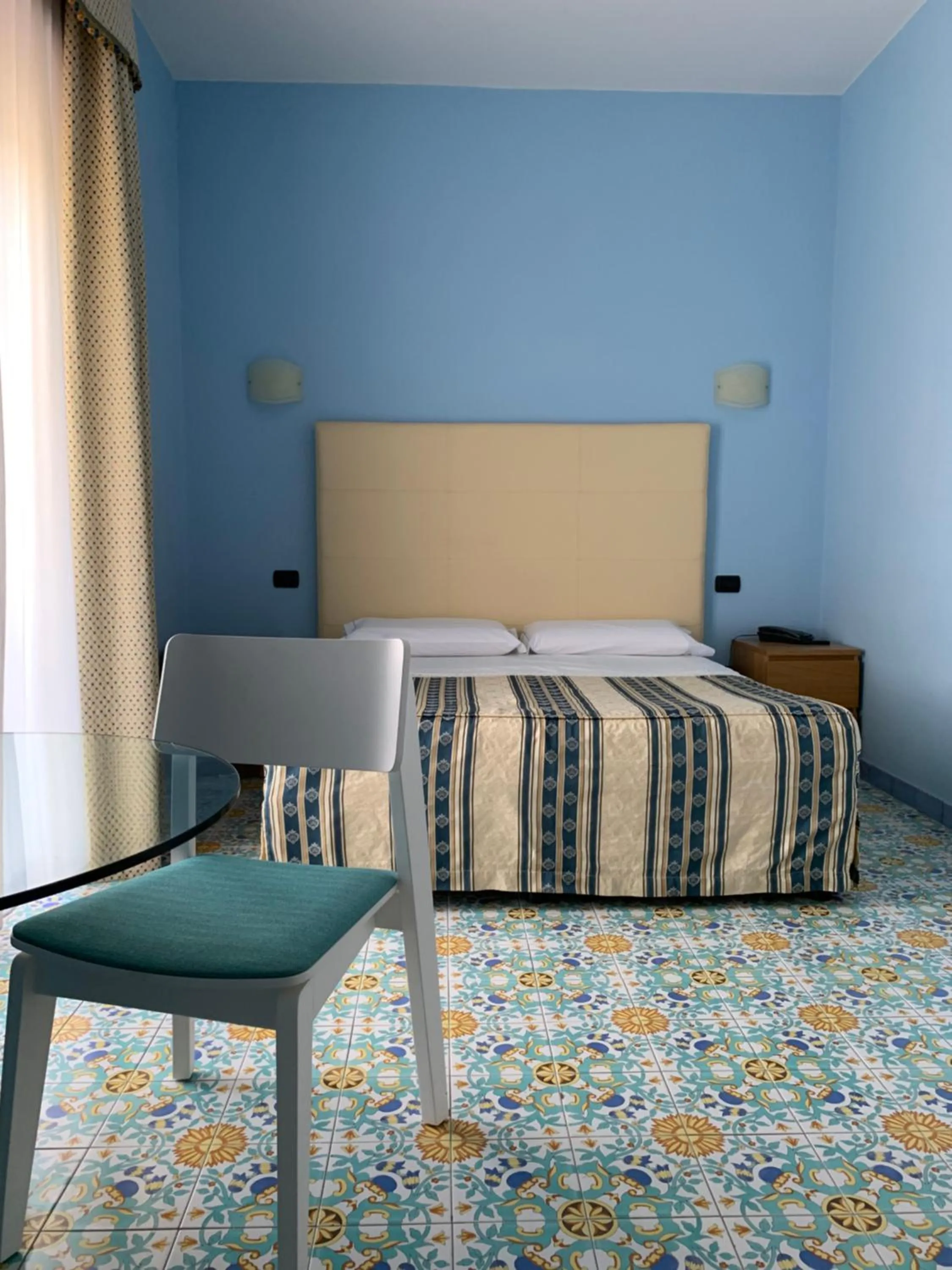 Bed in Hotel Paradiso