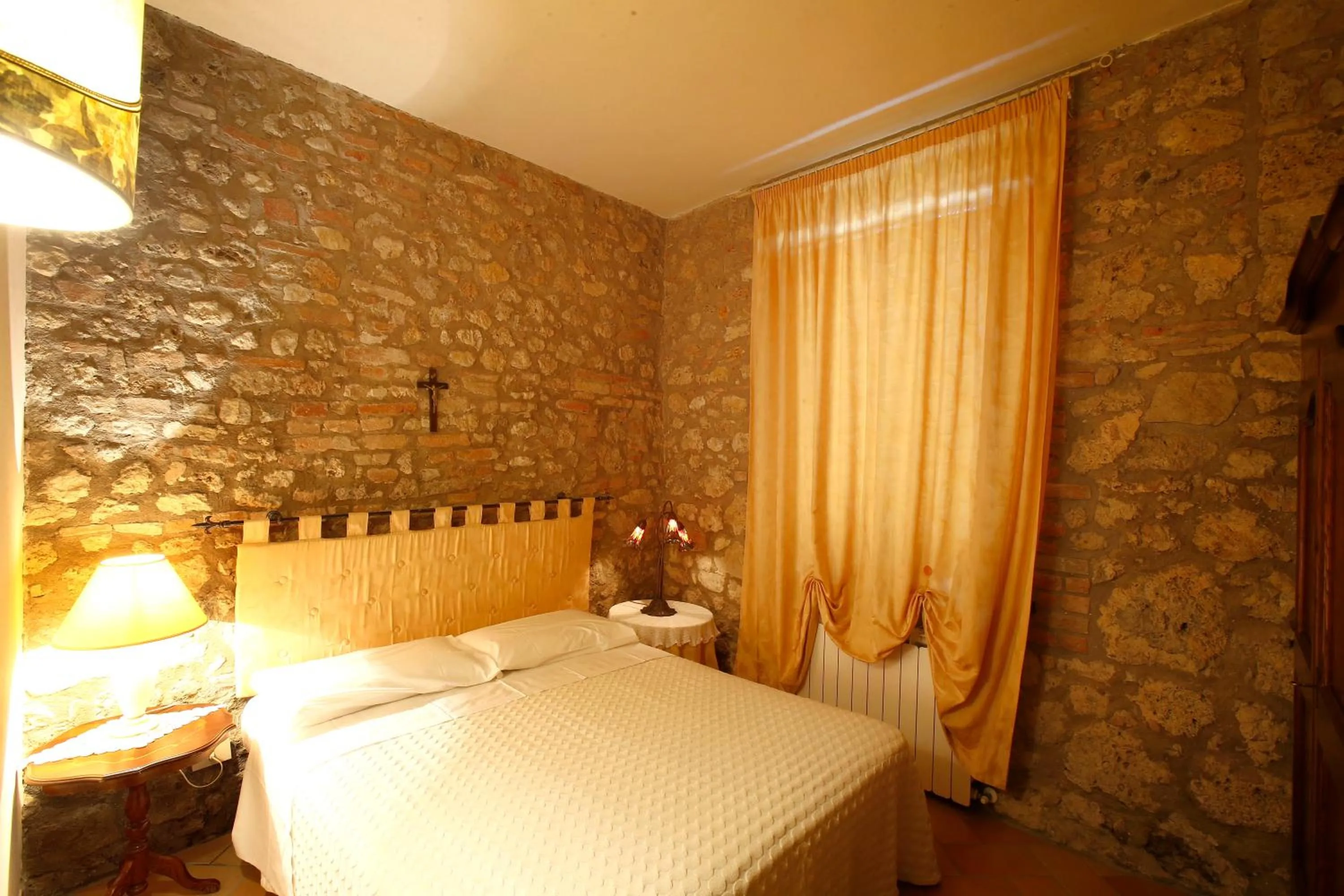 Photo of the whole room, Bed in Podere Lornanino