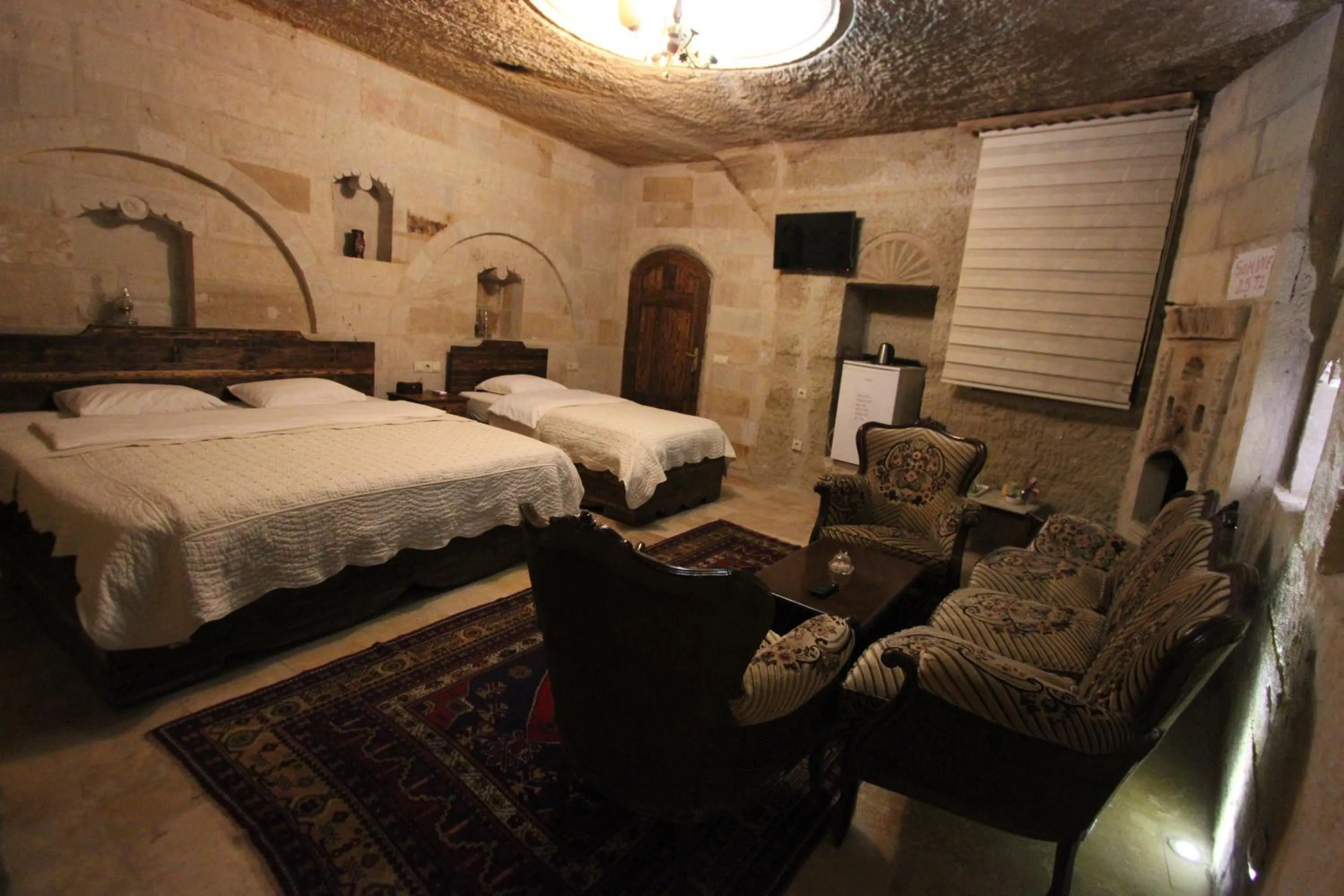 Photo of the whole room, Bed in Family Cave Suite Hotel