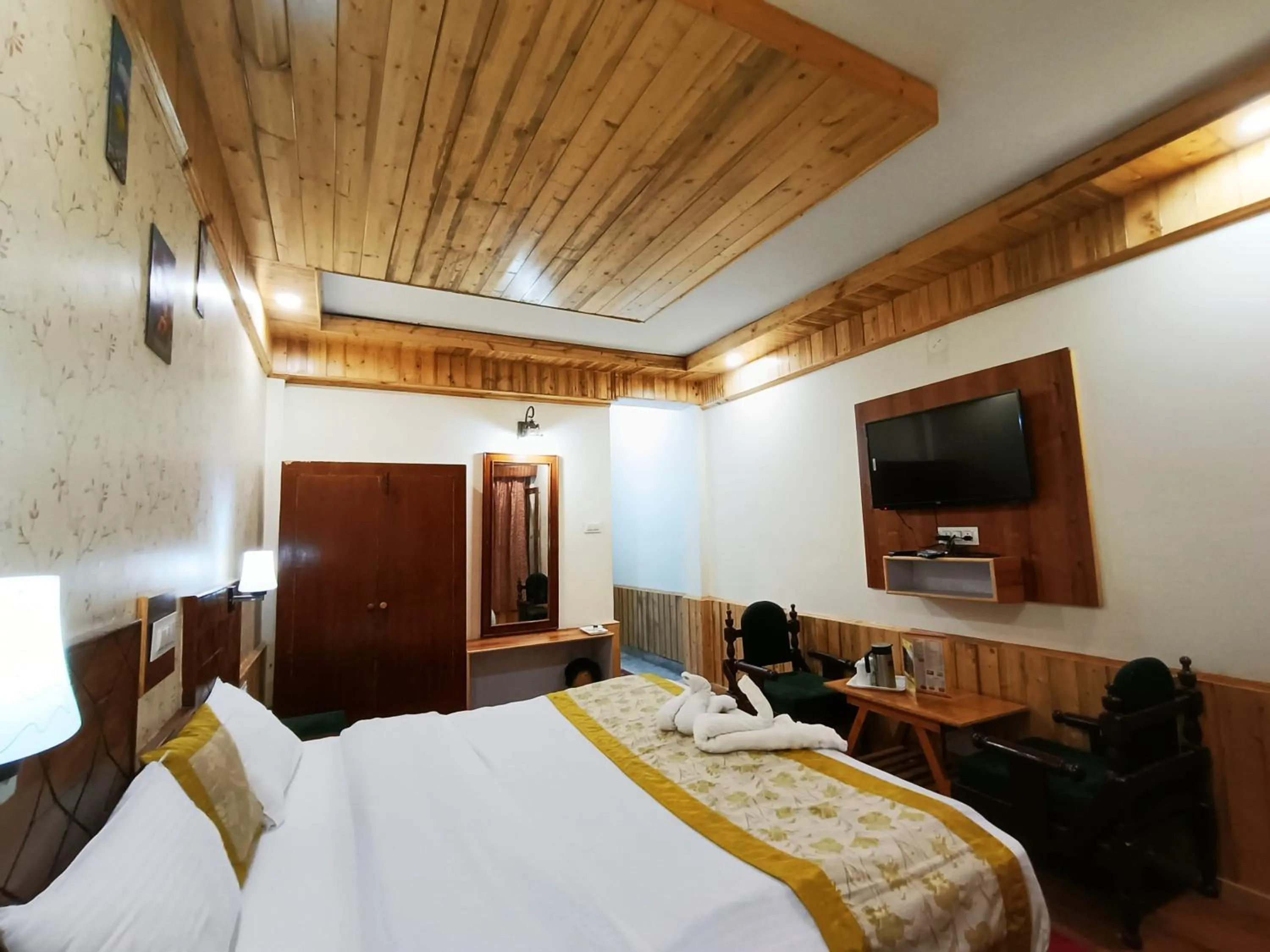 Photo of the whole room, Bed in CS Shhandella Hotel