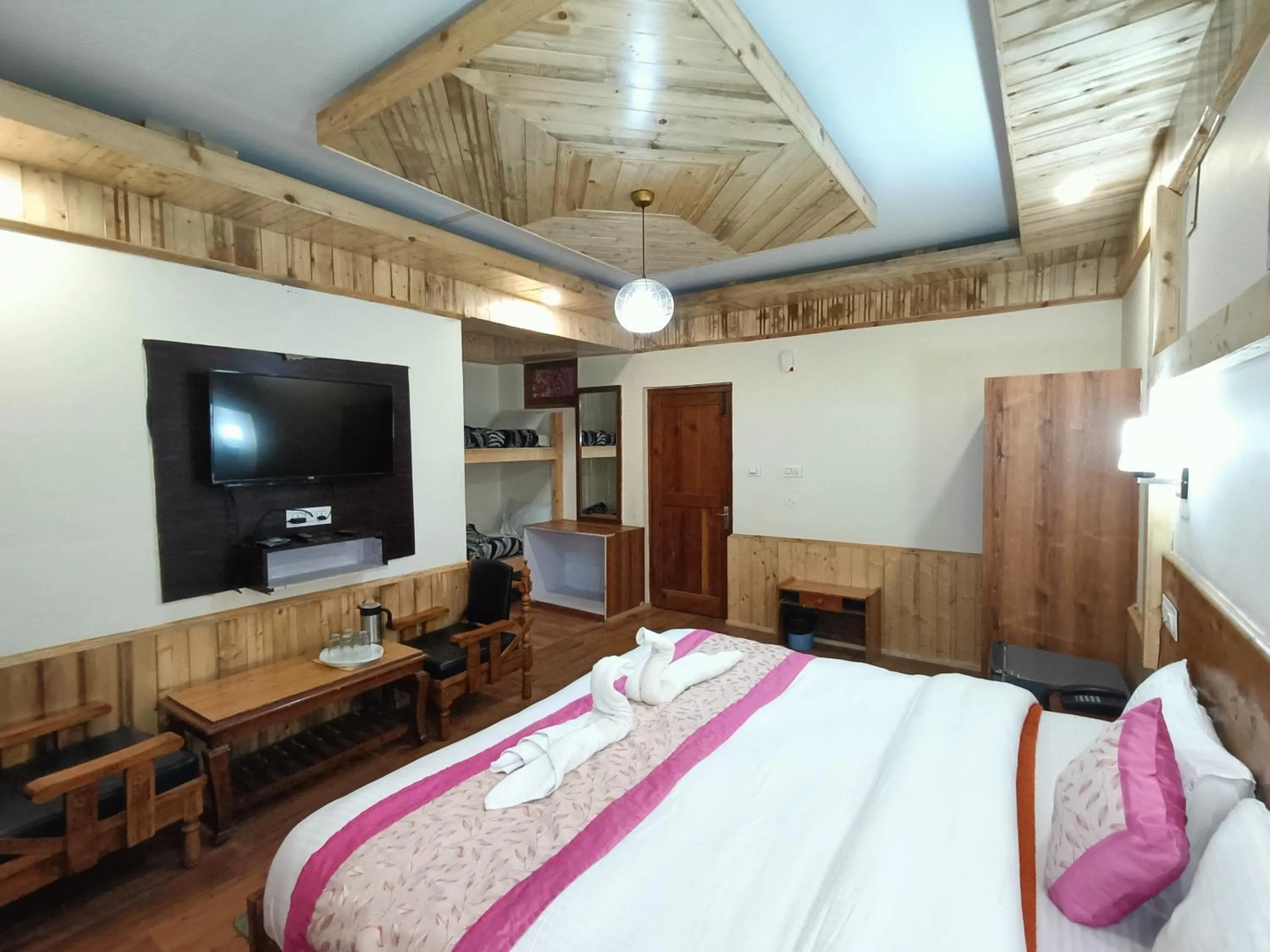 Bed in CS Shhandella Hotel