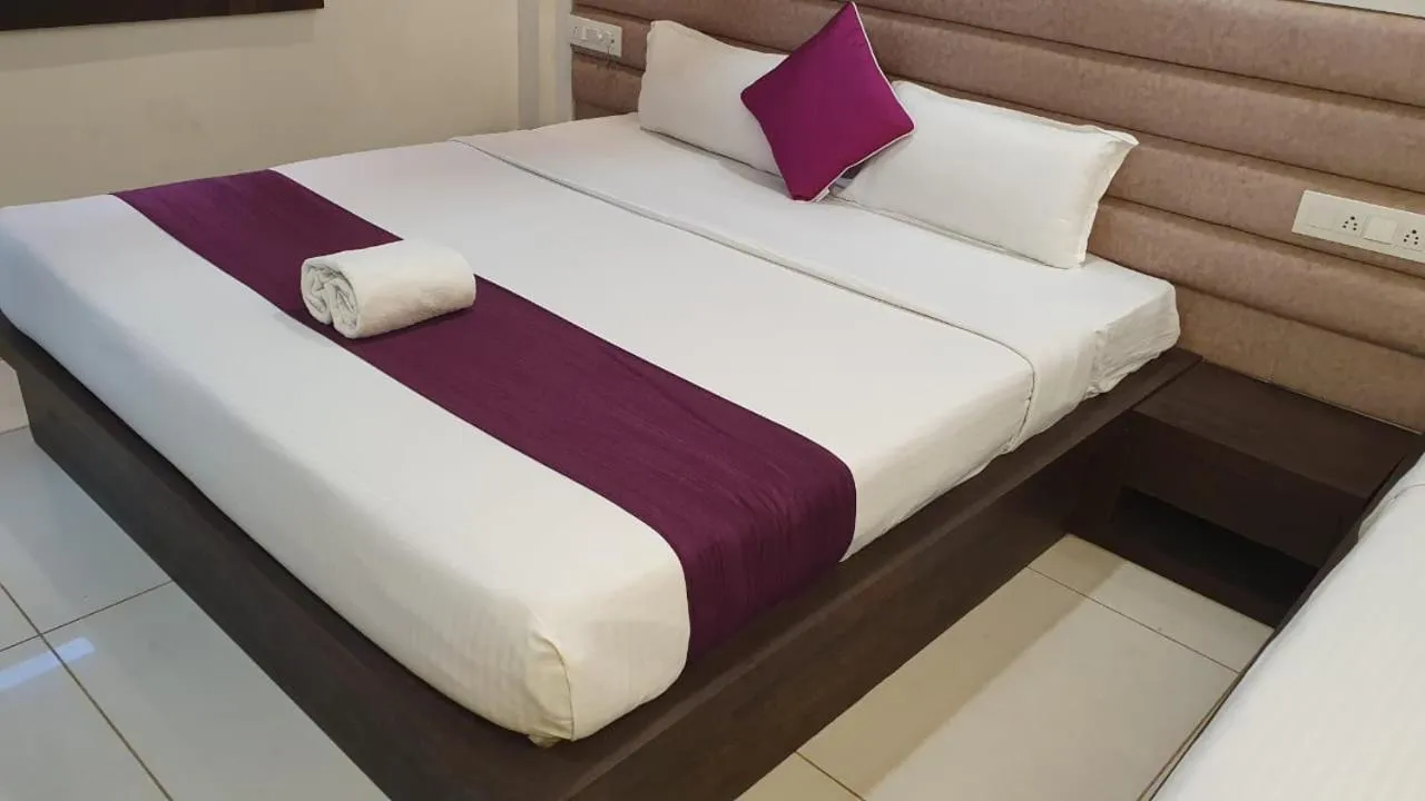 Bed in Hotel Siddhali Inn