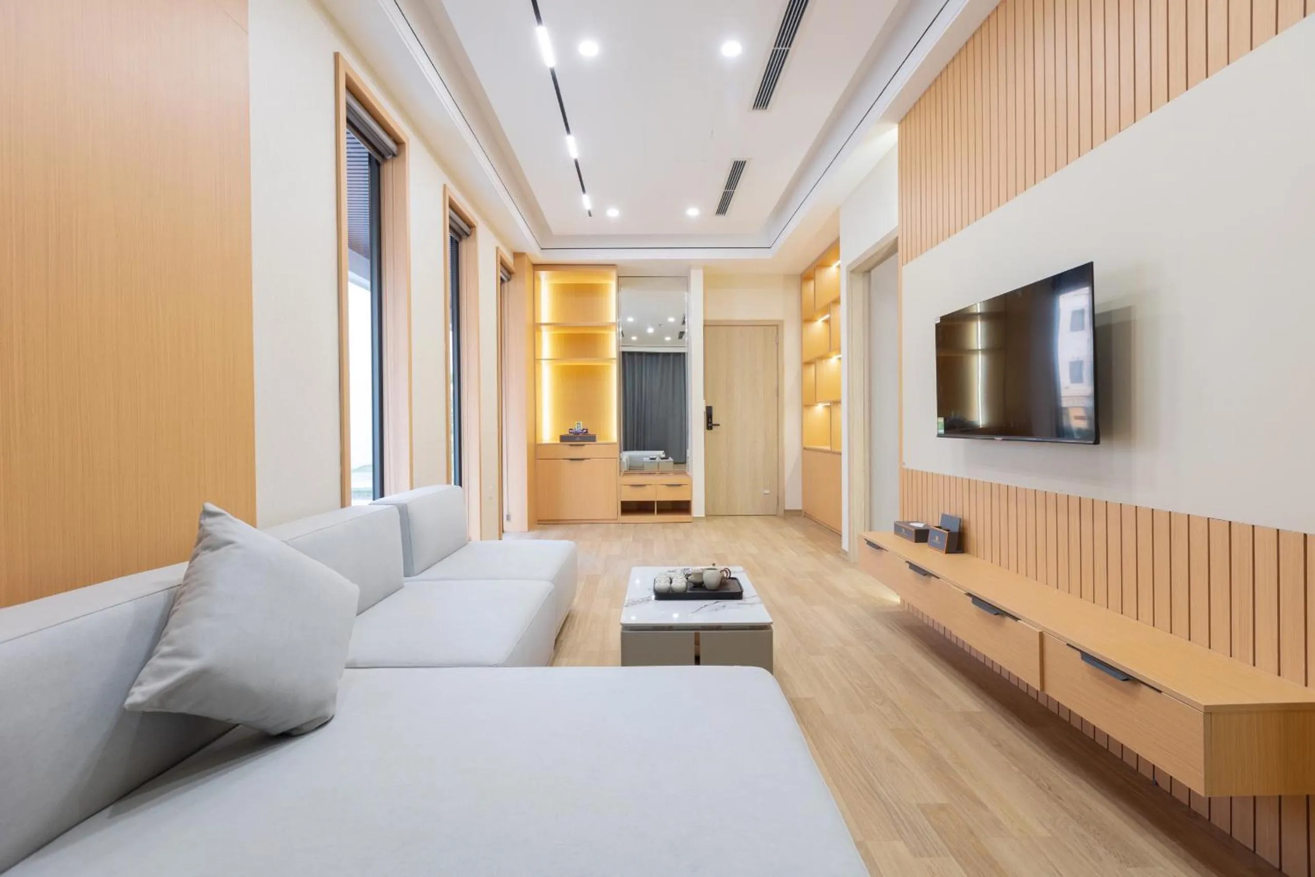 Living room, Bed in Sunshine Apartment Hotel