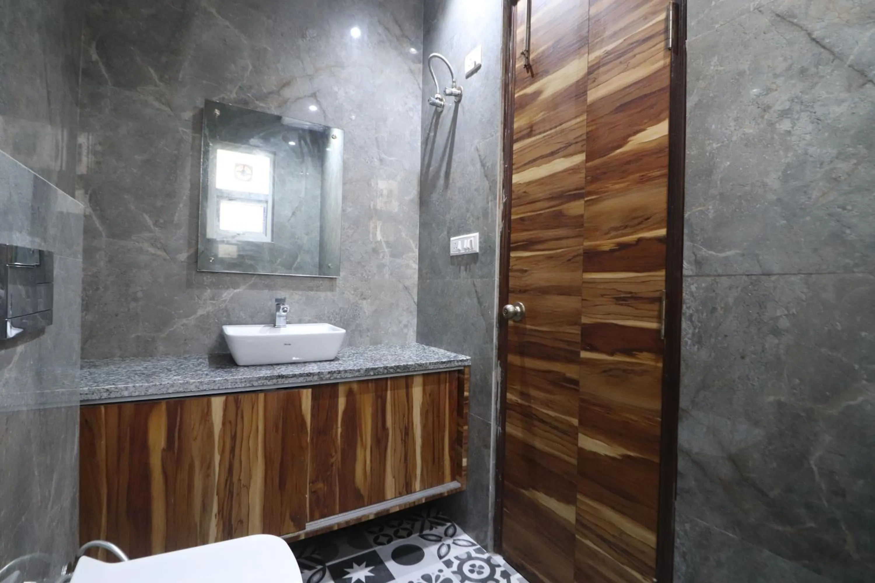 Bathroom in Twamev couple Friendly Rajouri garden by The Arrow