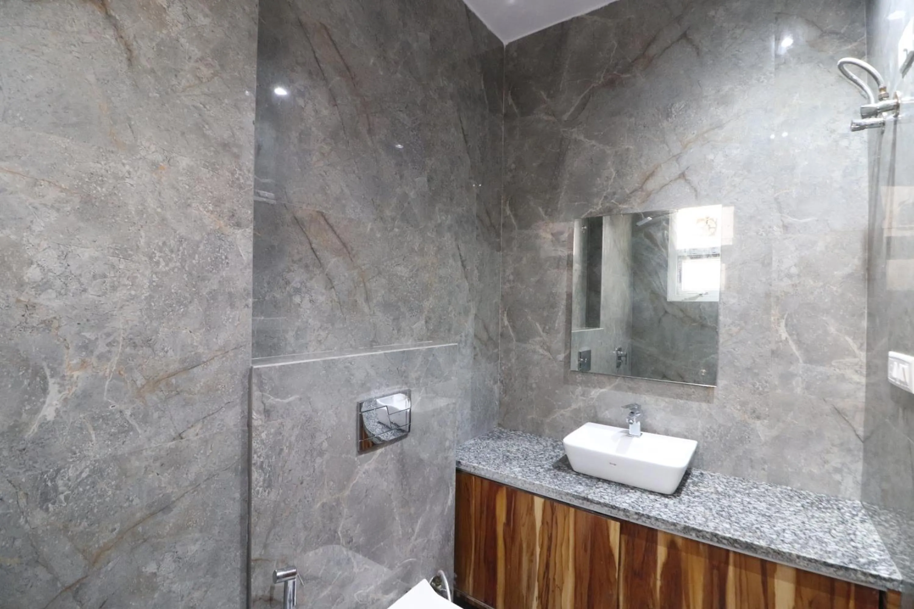 Bathroom in Twamev couple Friendly Rajouri garden by The Arrow