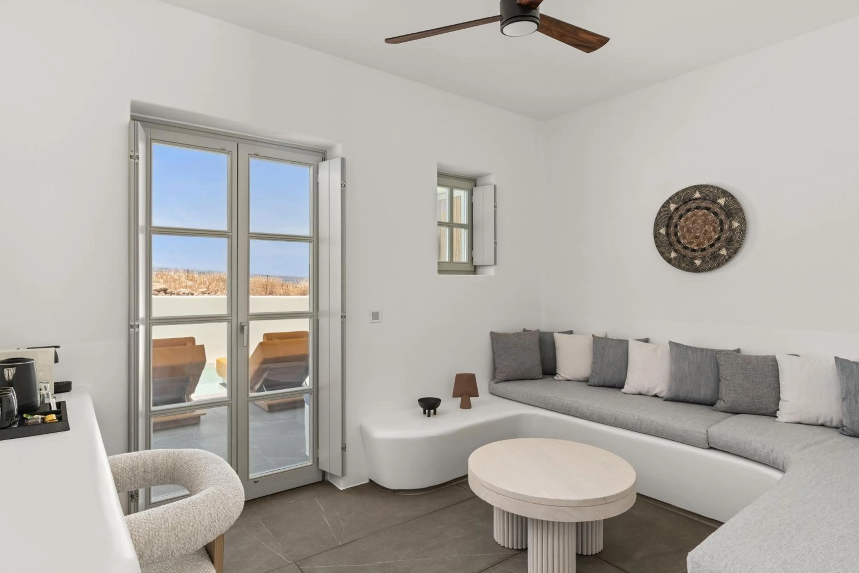 Seating area in Mr & Mrs White Paros Suites & More