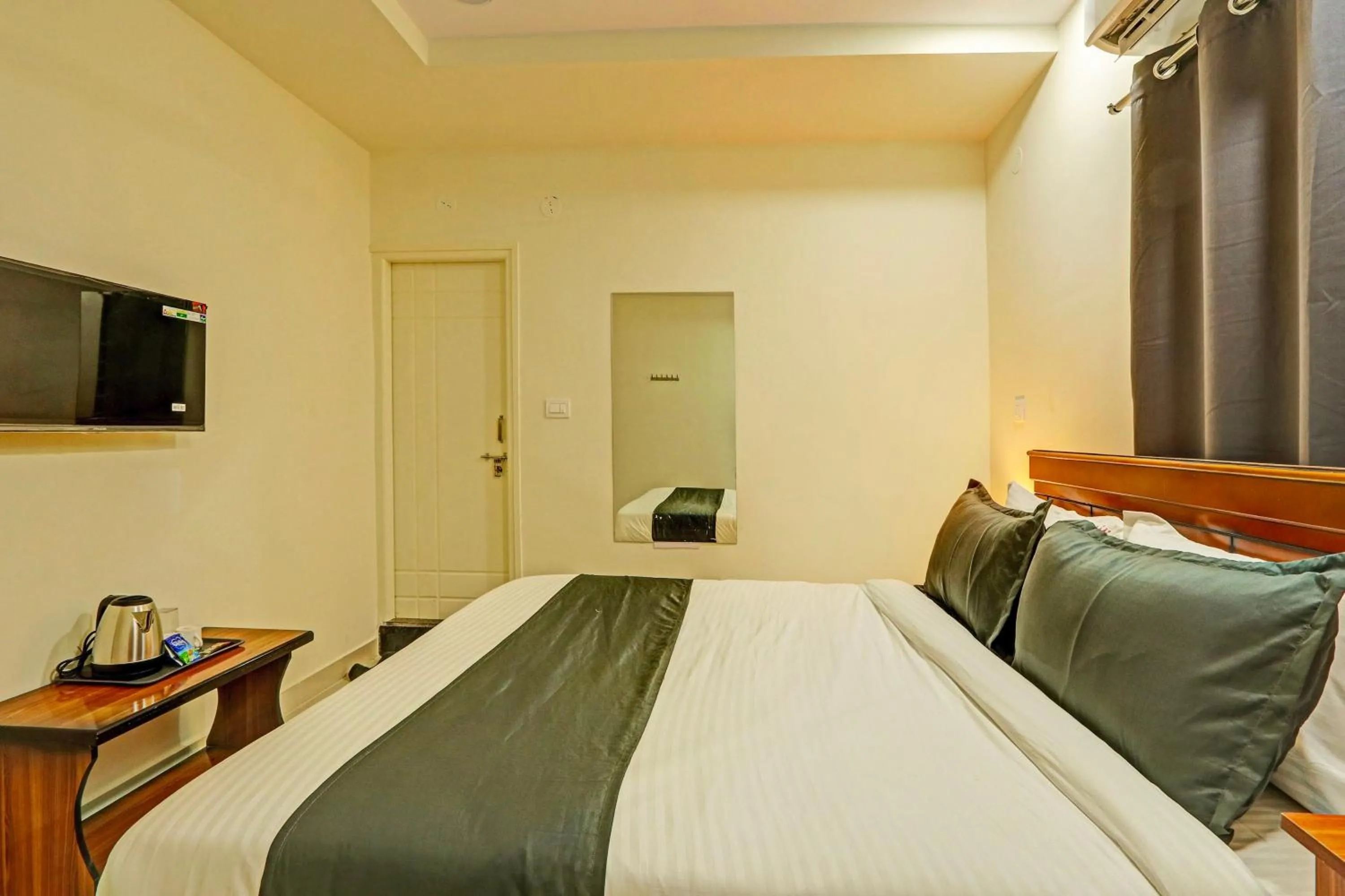 Bedroom in Hotel O JVP Hotels
