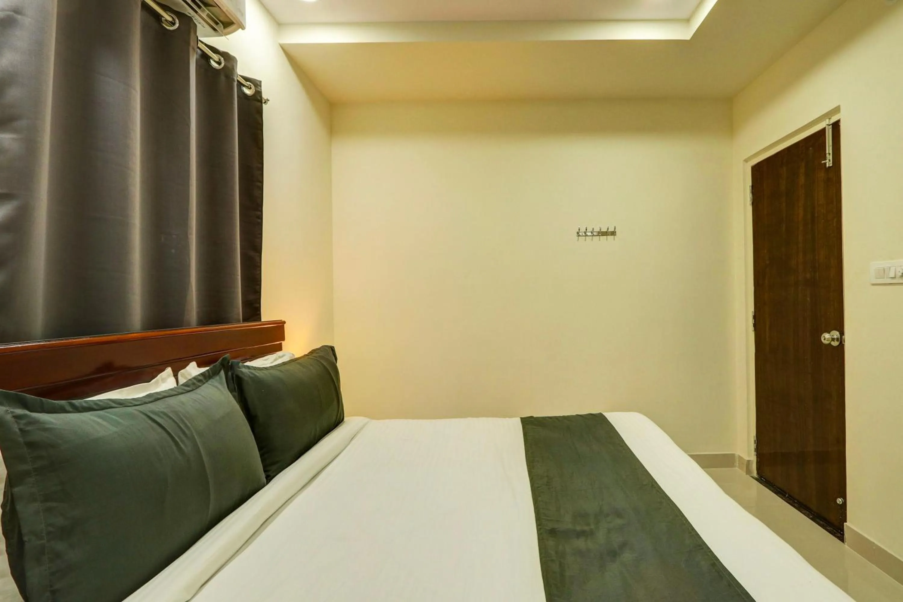 Bedroom in Hotel O JVP Hotels