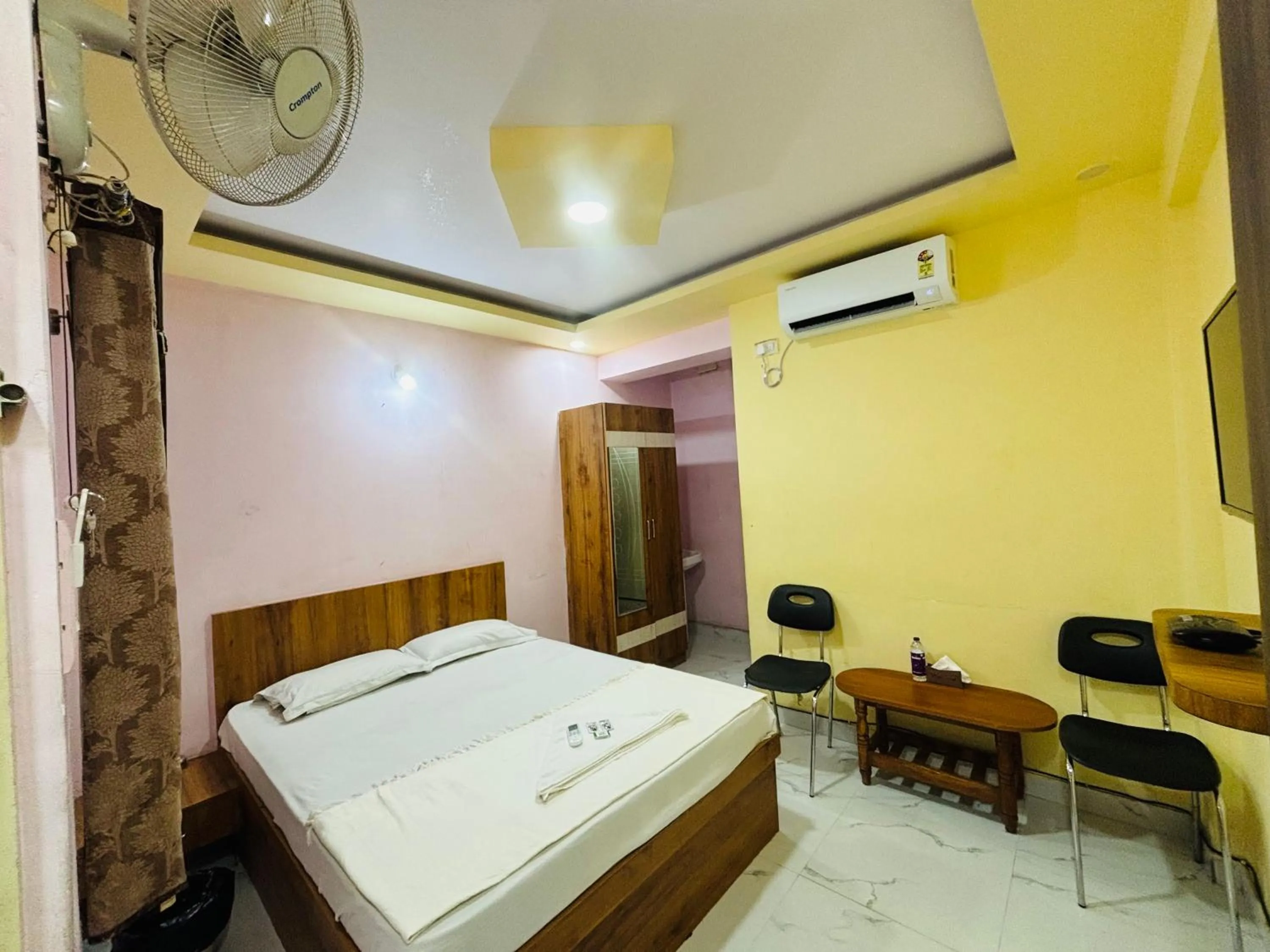 Bed in Mandara Comforts Hotel