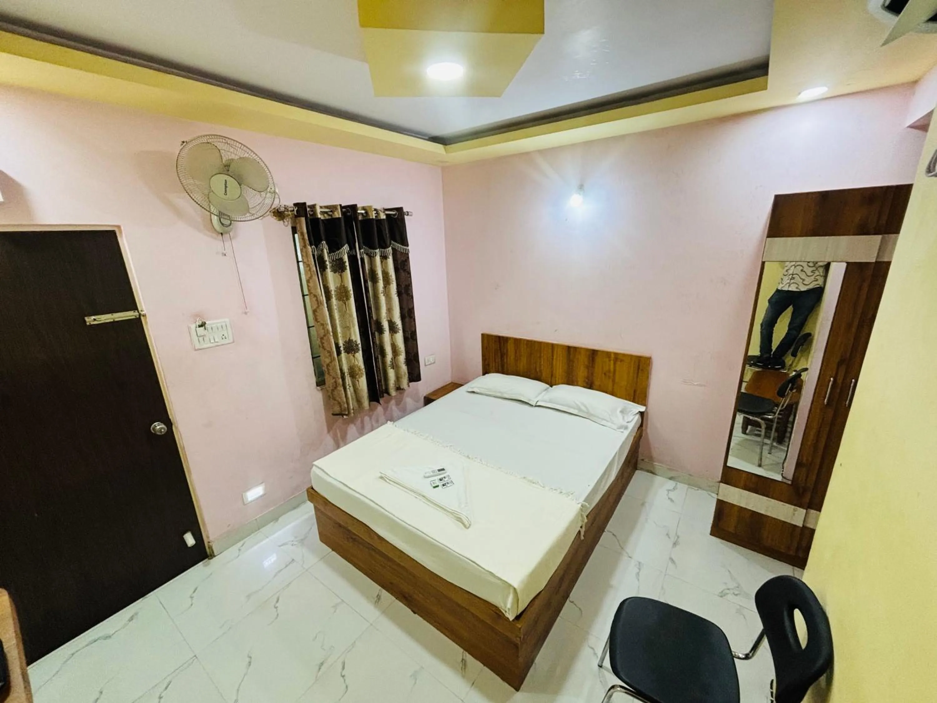 Bed in Mandara Comforts Hotel