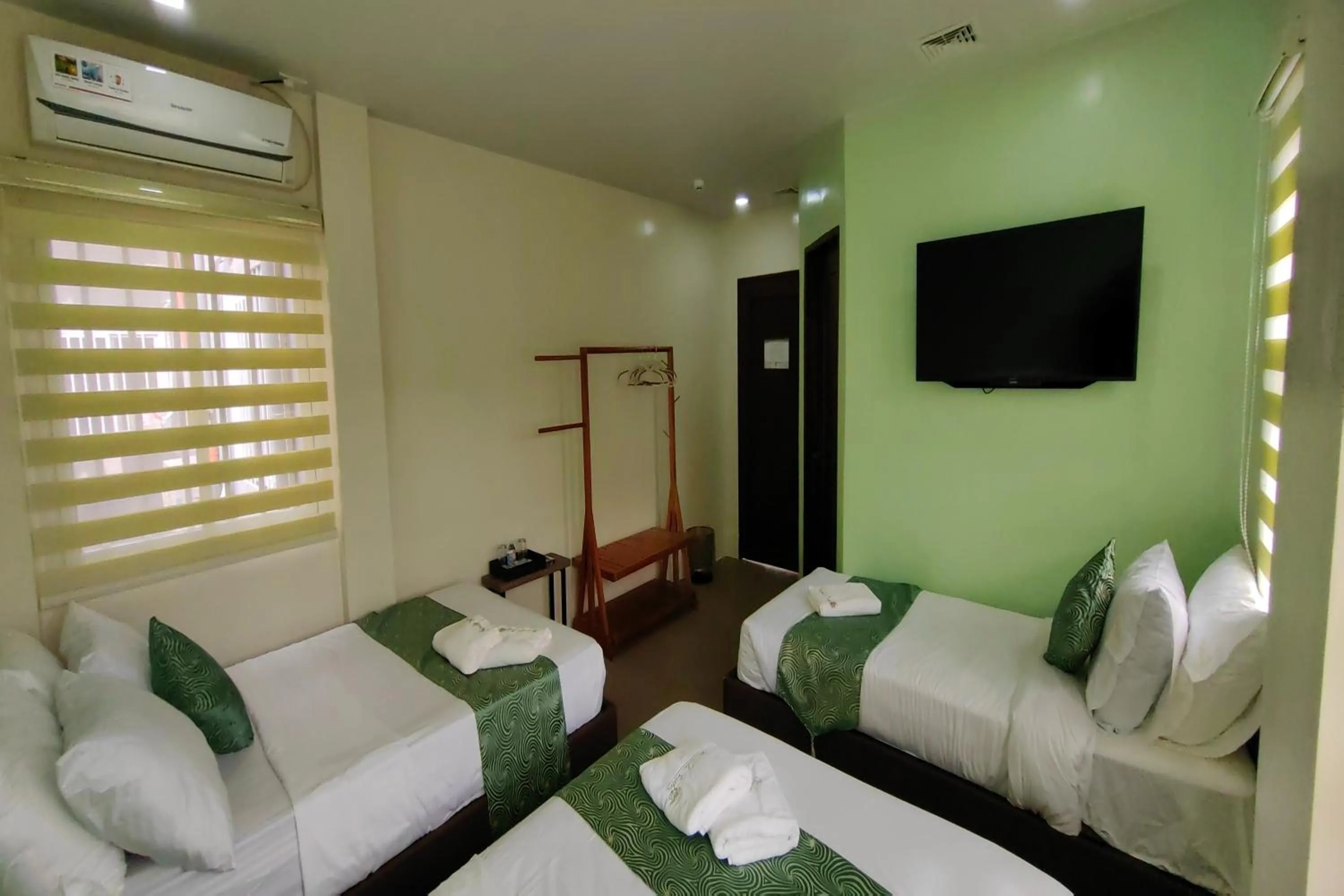 Bed in Manuela Suites Puerto Princesa near Airport
