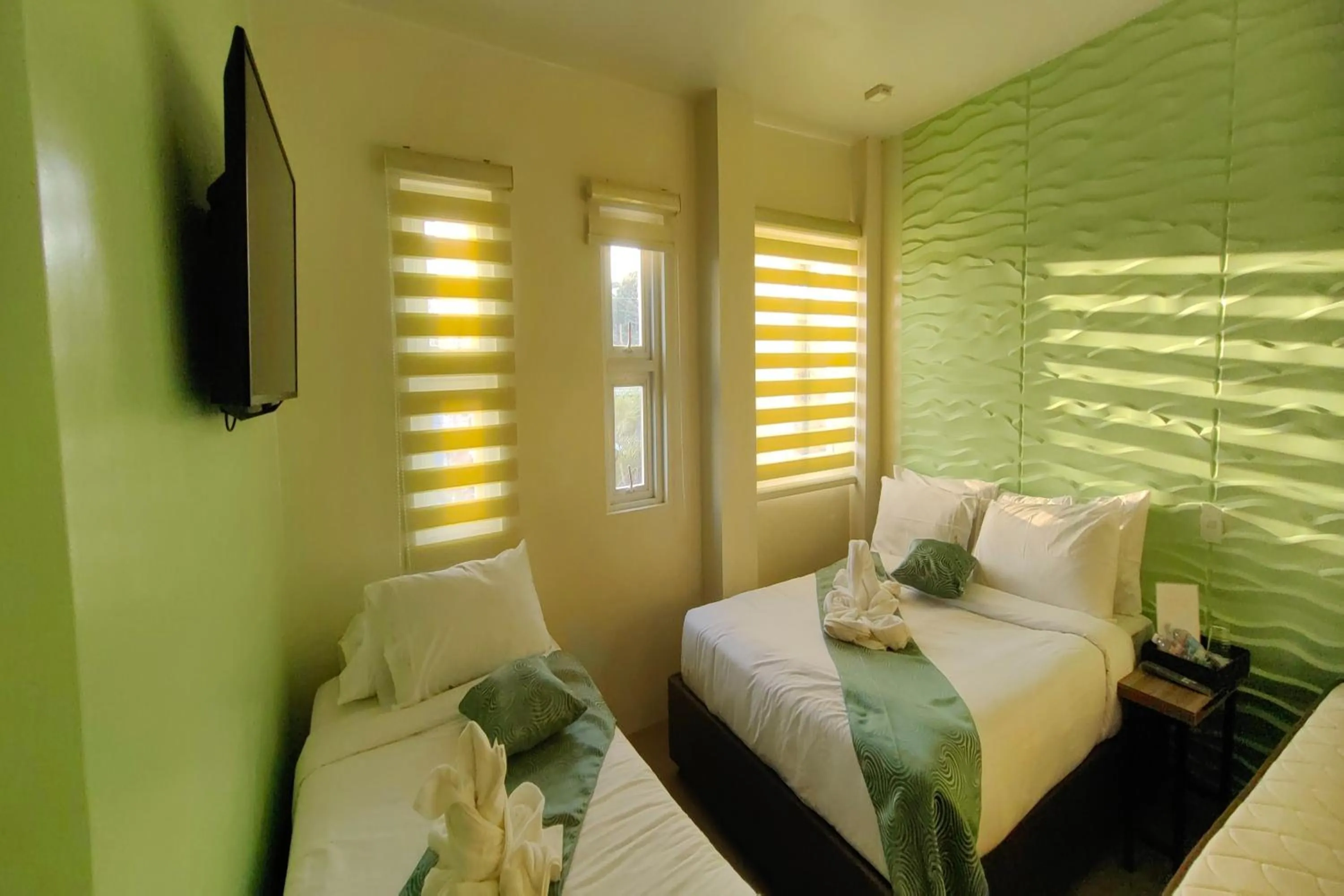 Bed in Manuela Suites Puerto Princesa near Airport