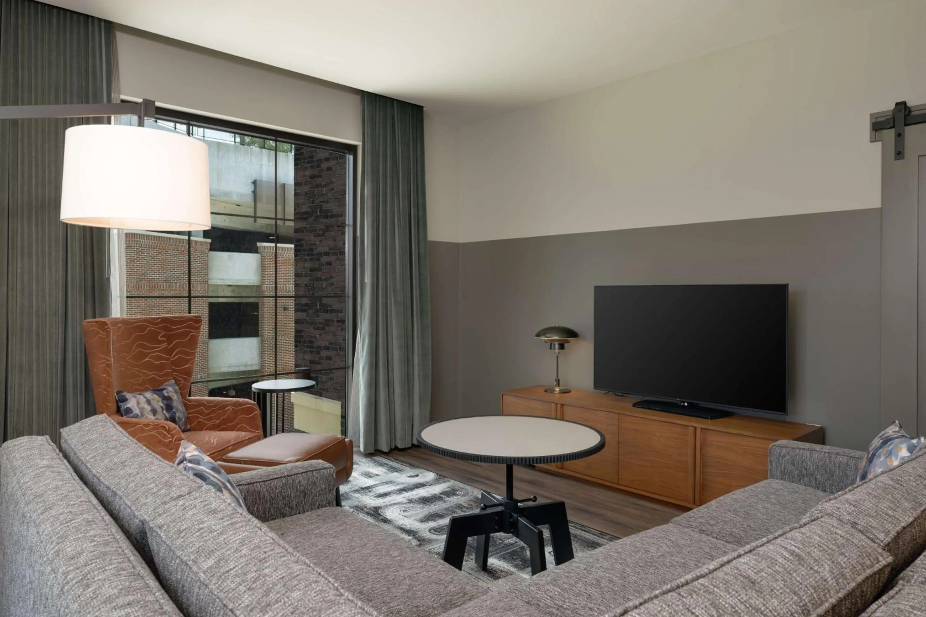 Living room in Hotel Nickel Plate Fishers, Tapestry Collection By Hilton