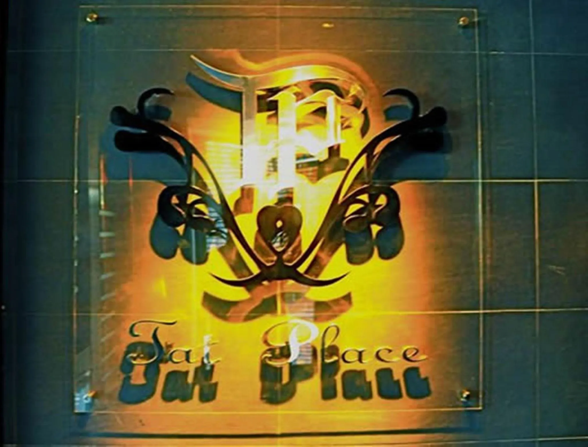 Property logo or sign in Tat Place Hotel