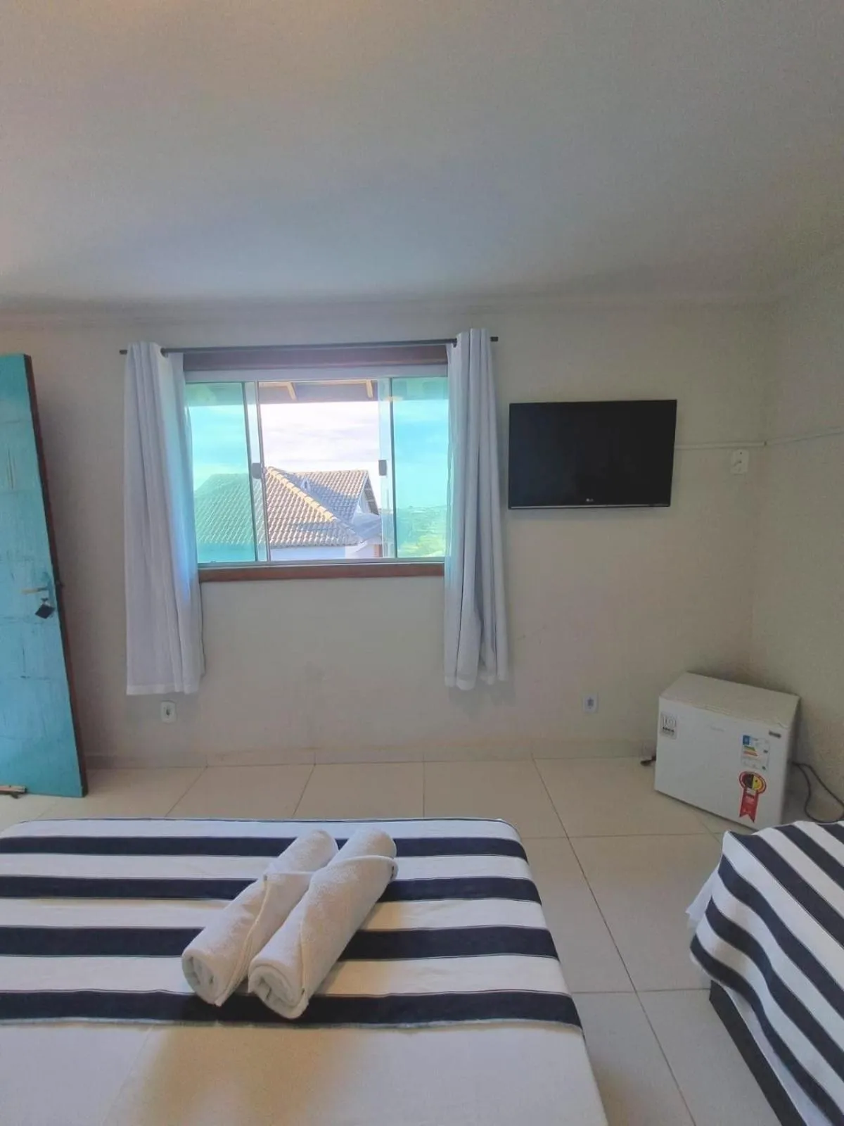 Photo of the whole room, Bed in Terra Nova Cabo Frio Front Beach