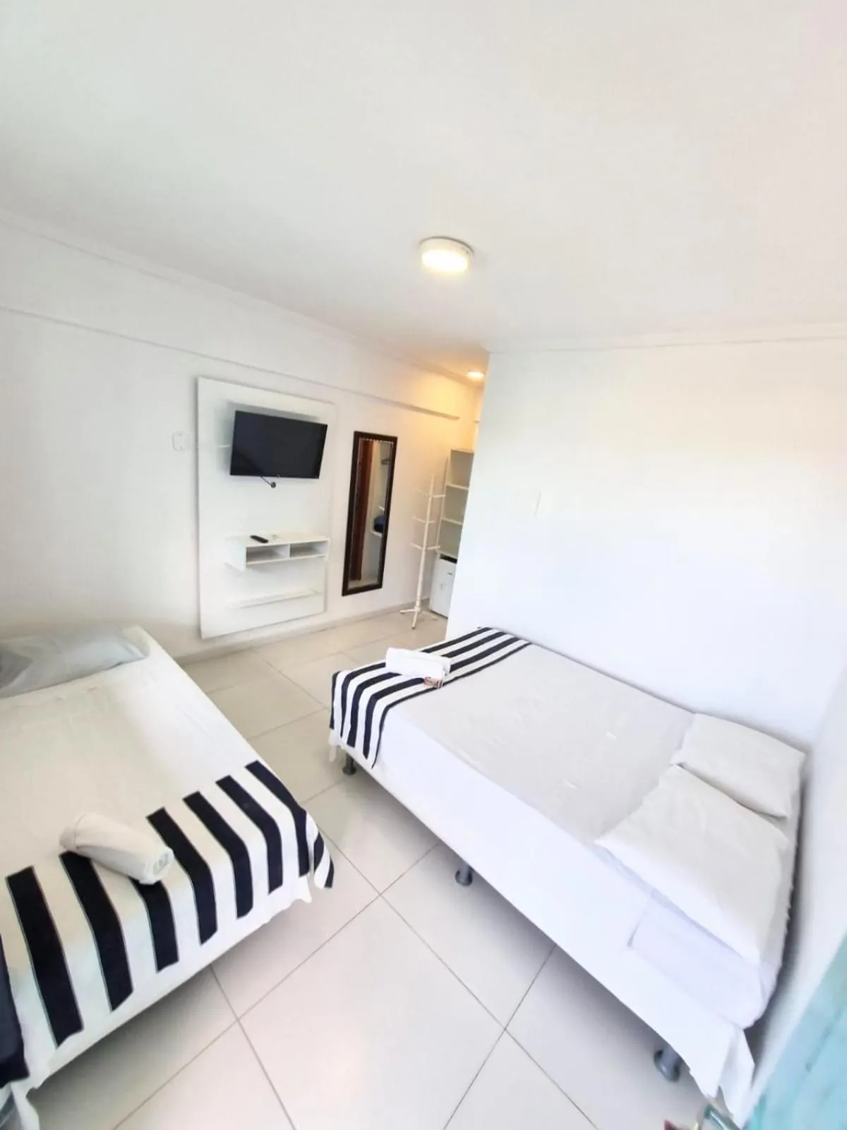 Photo of the whole room, Bed in Terra Nova Cabo Frio Front Beach