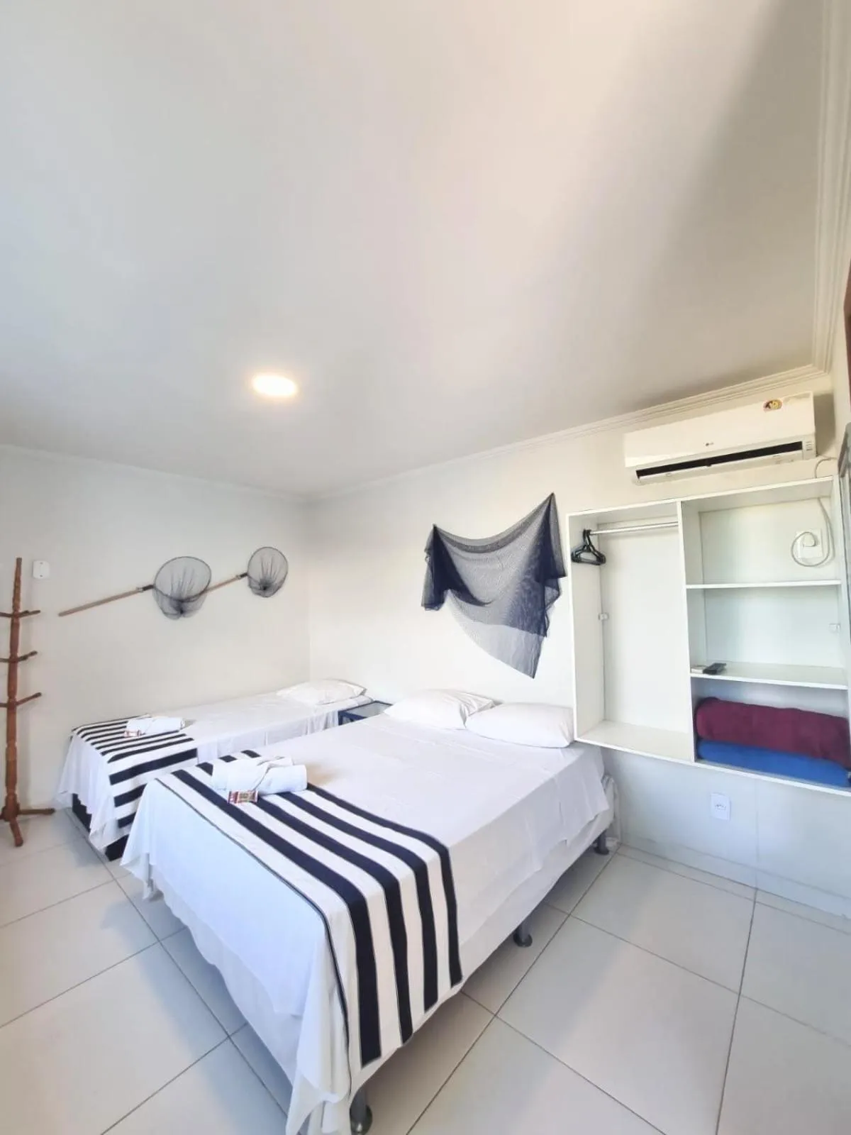 Photo of the whole room, Bed in Terra Nova Cabo Frio Front Beach