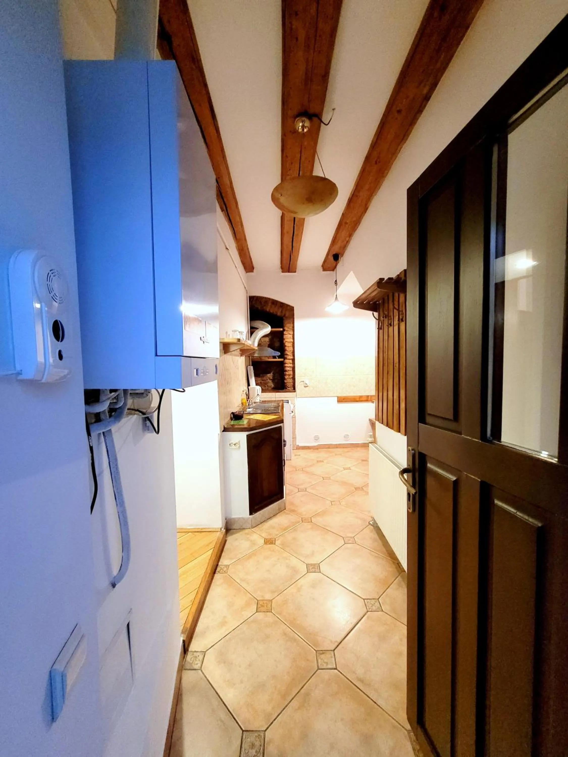 Kitchen or kitchenette in Main Square Apartments & More