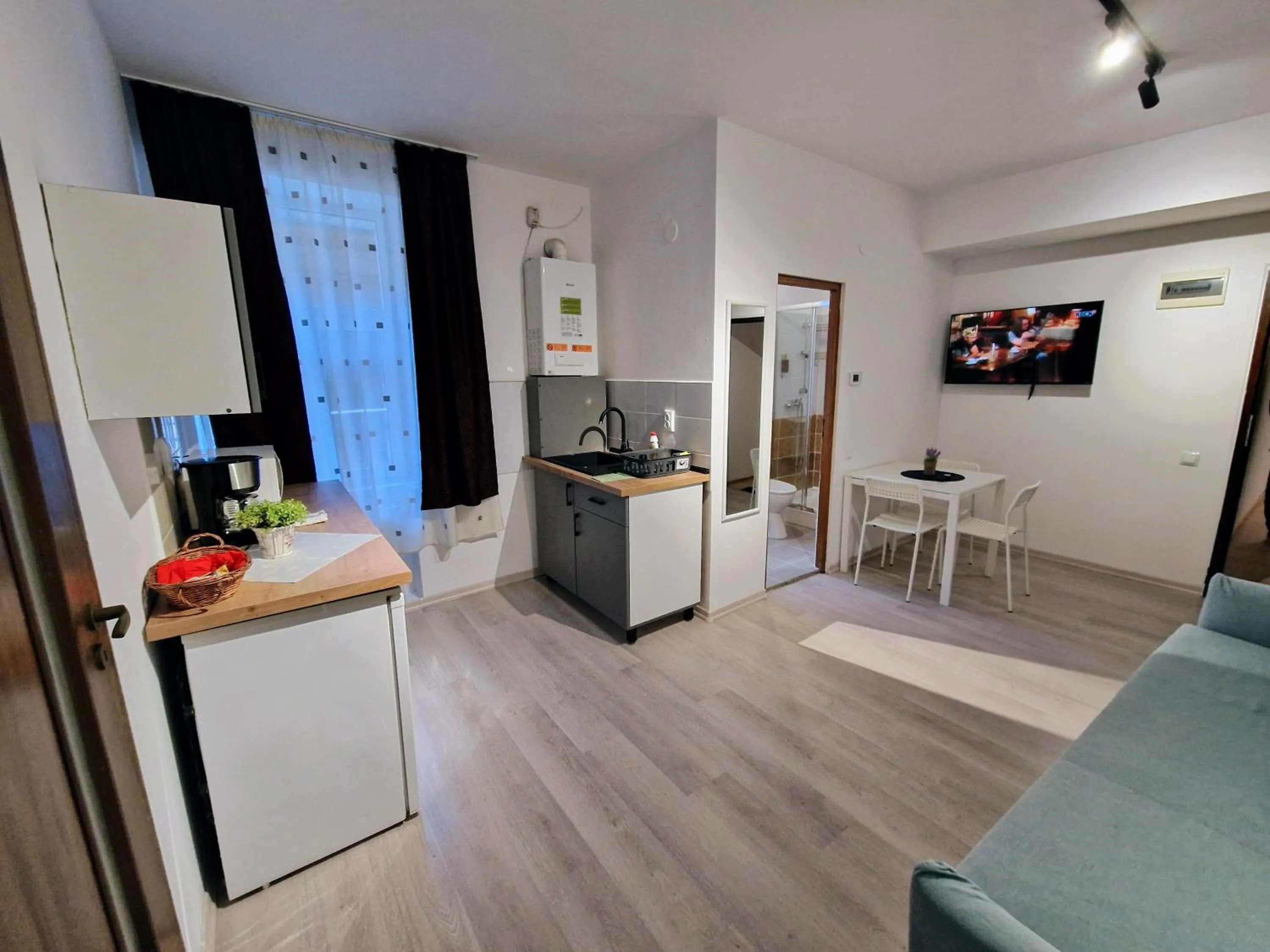Kitchen or kitchenette in Main Square Apartments & More