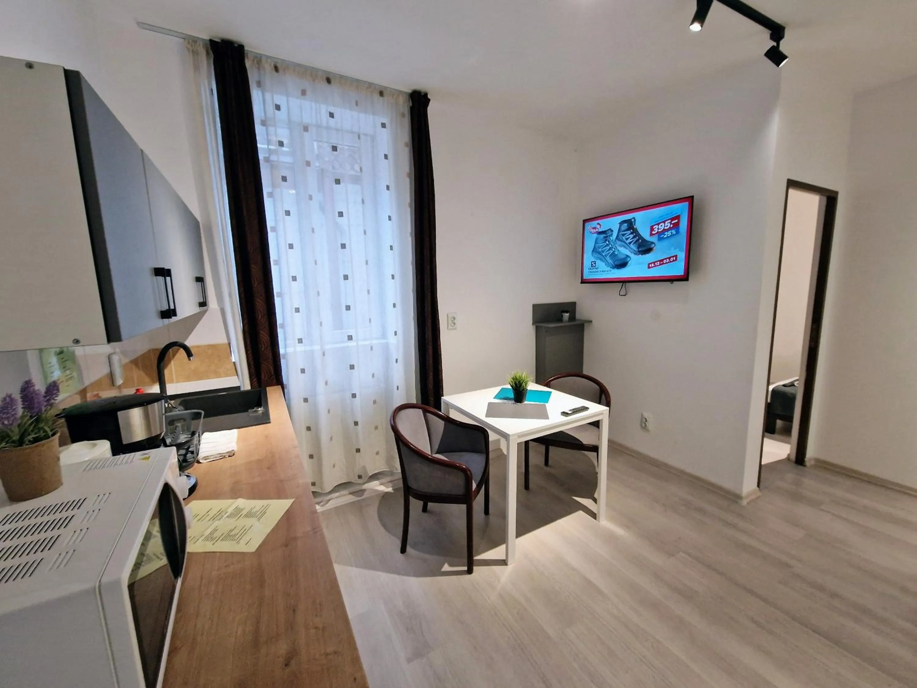 Kitchen or kitchenette in Main Square Apartments & More