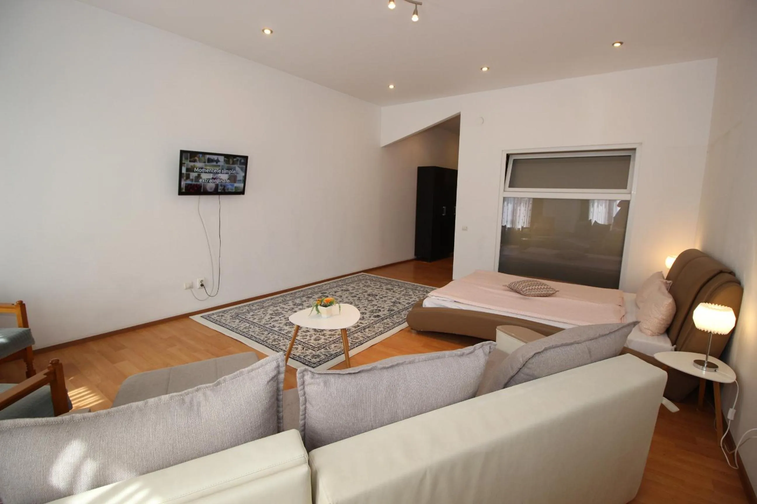 Living room, Bed in Main Square Apartments & More