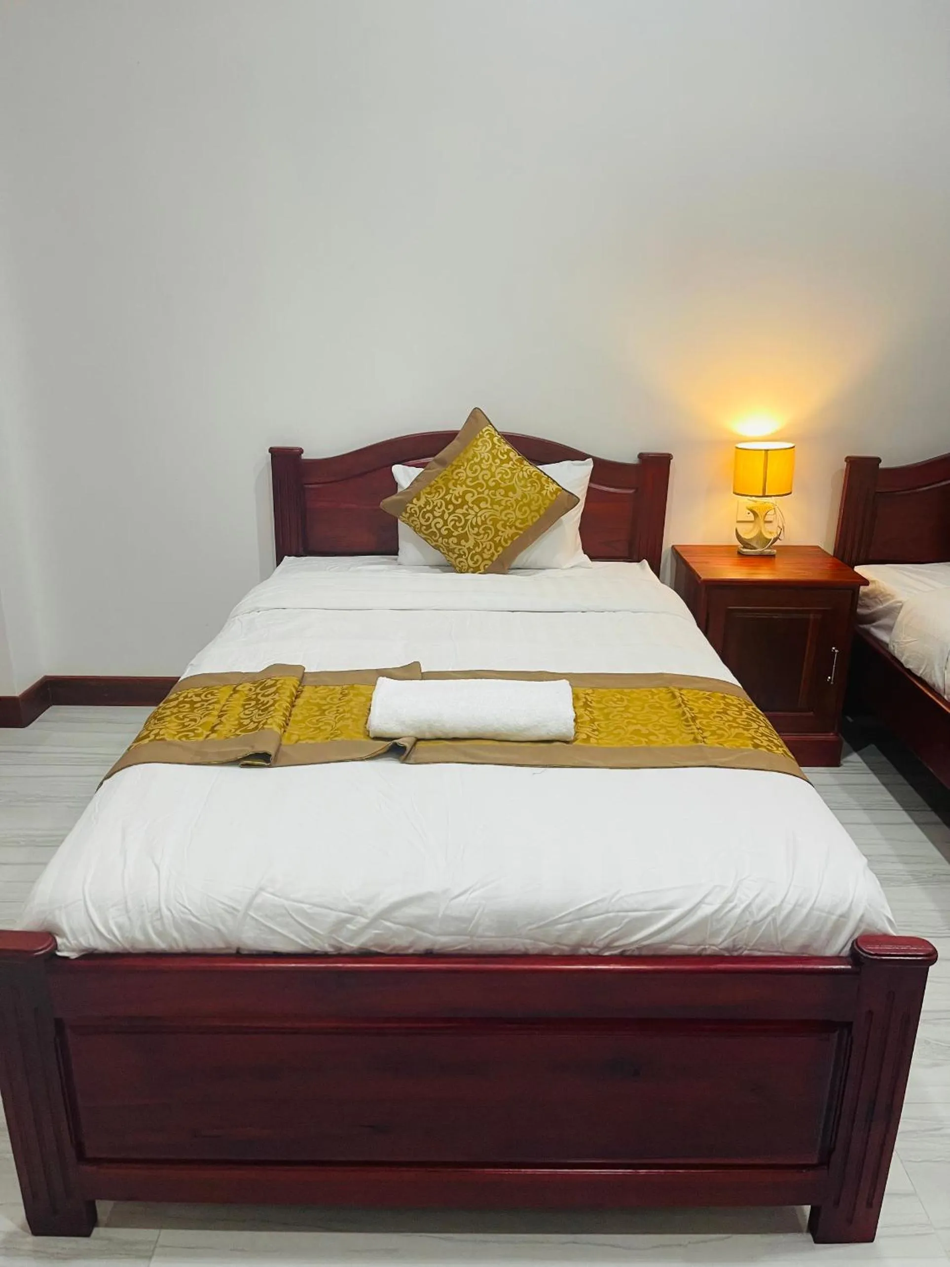 Bed in PhaiLin Hotel