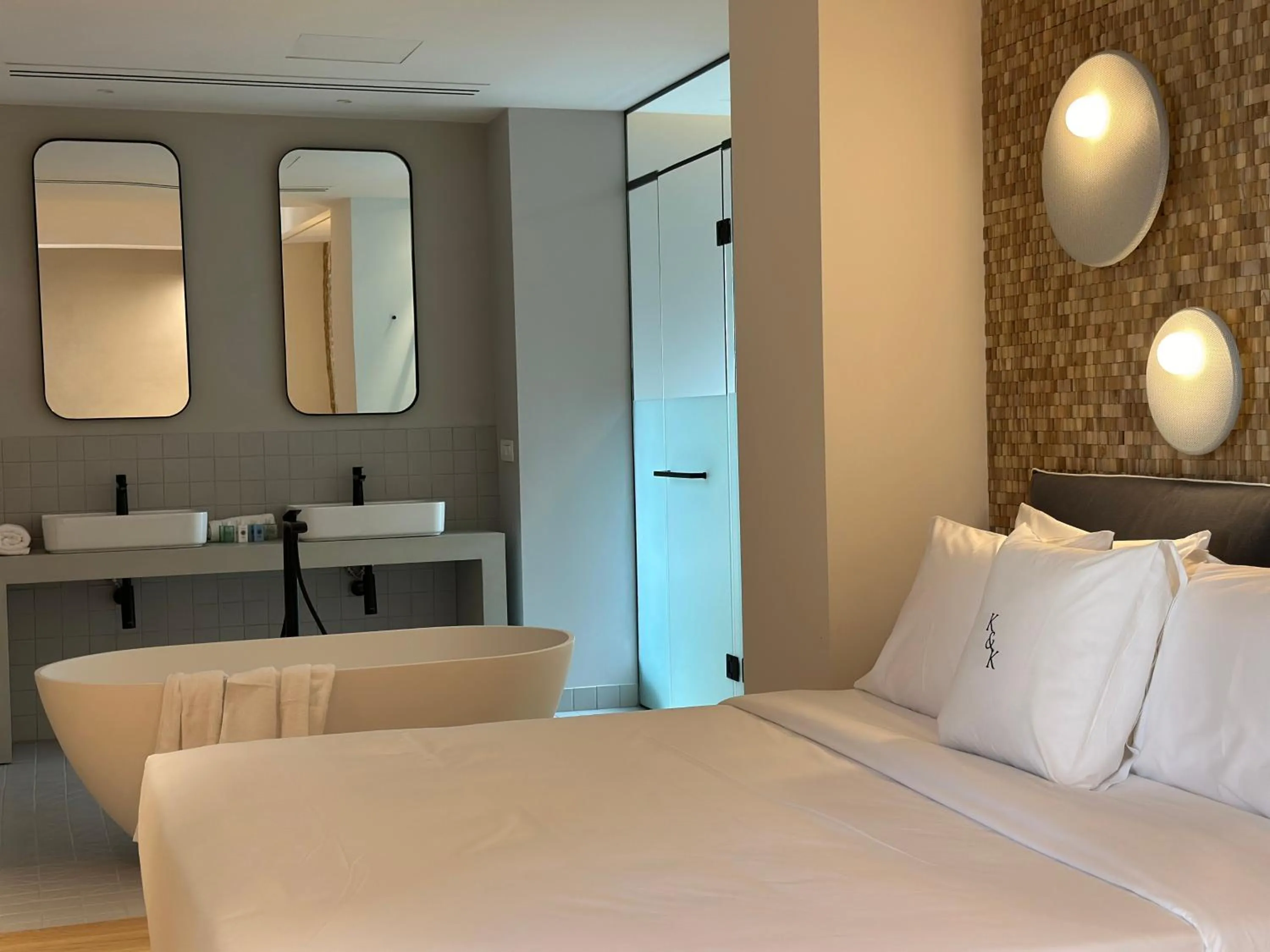 Bed in AIONION RESIDENCES by K&K